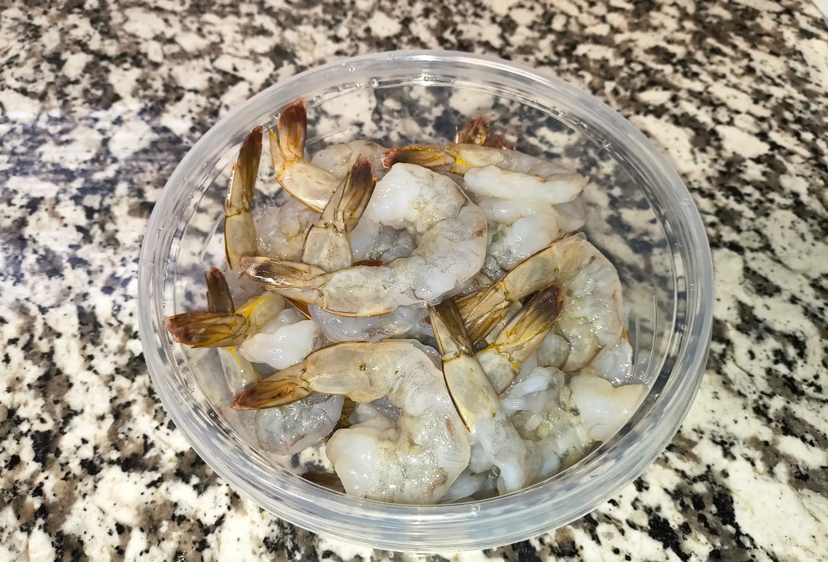 Peeling and prepping shrimp for Ina Garten's shrimp scampi recipe.