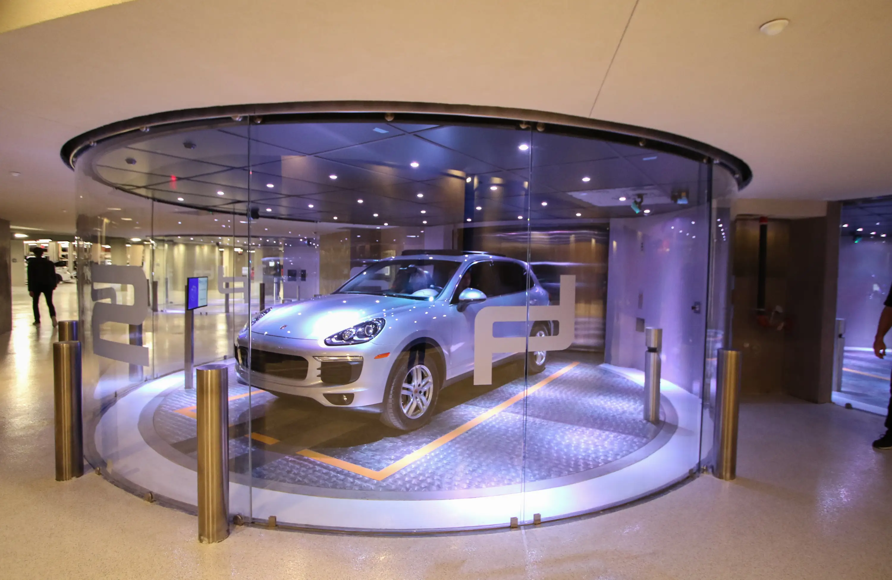 A Porsche inside a car elevator.