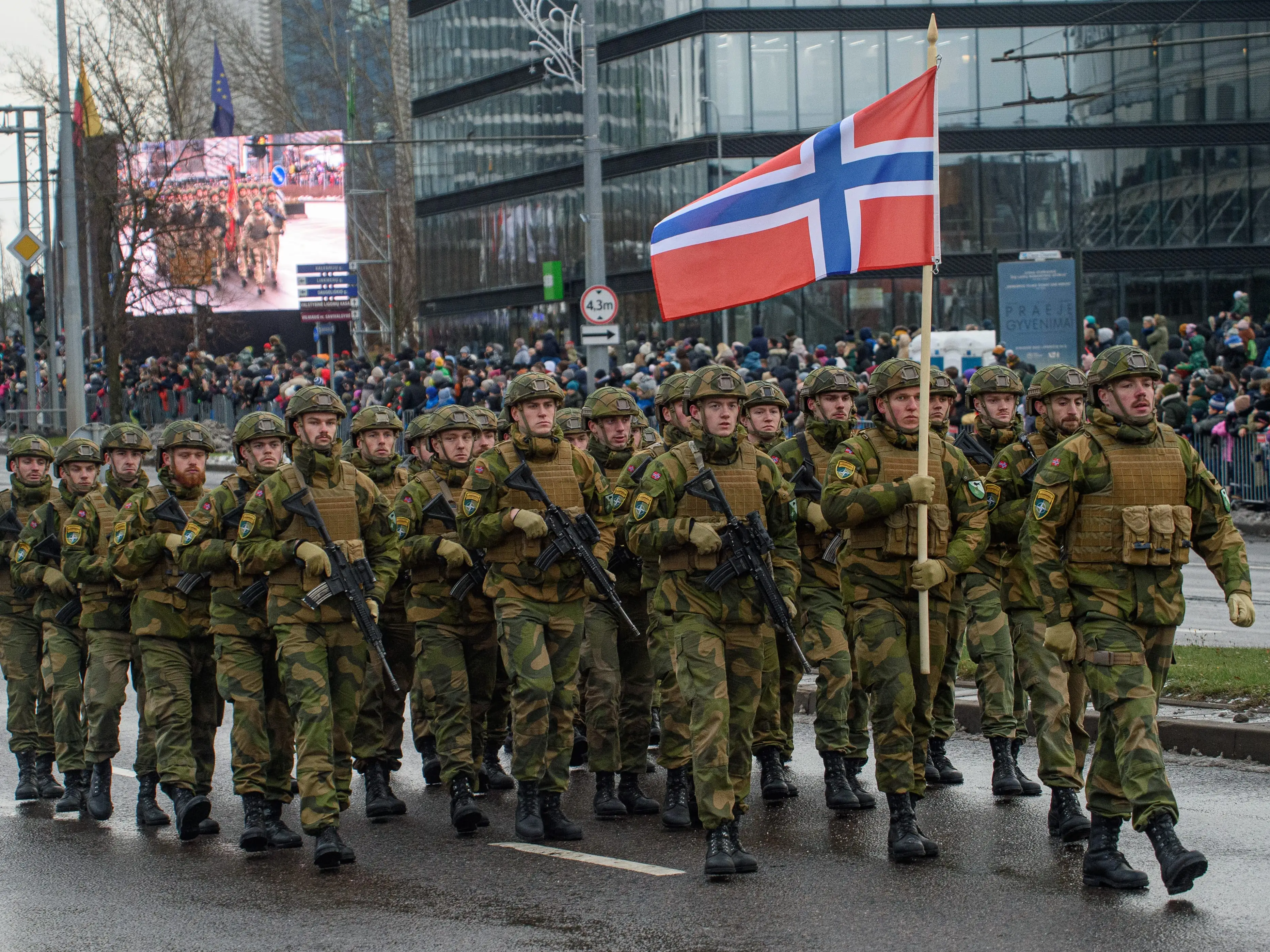 Norwegian soldiers march during a military parade on Armed Forces Day in Vilnius.