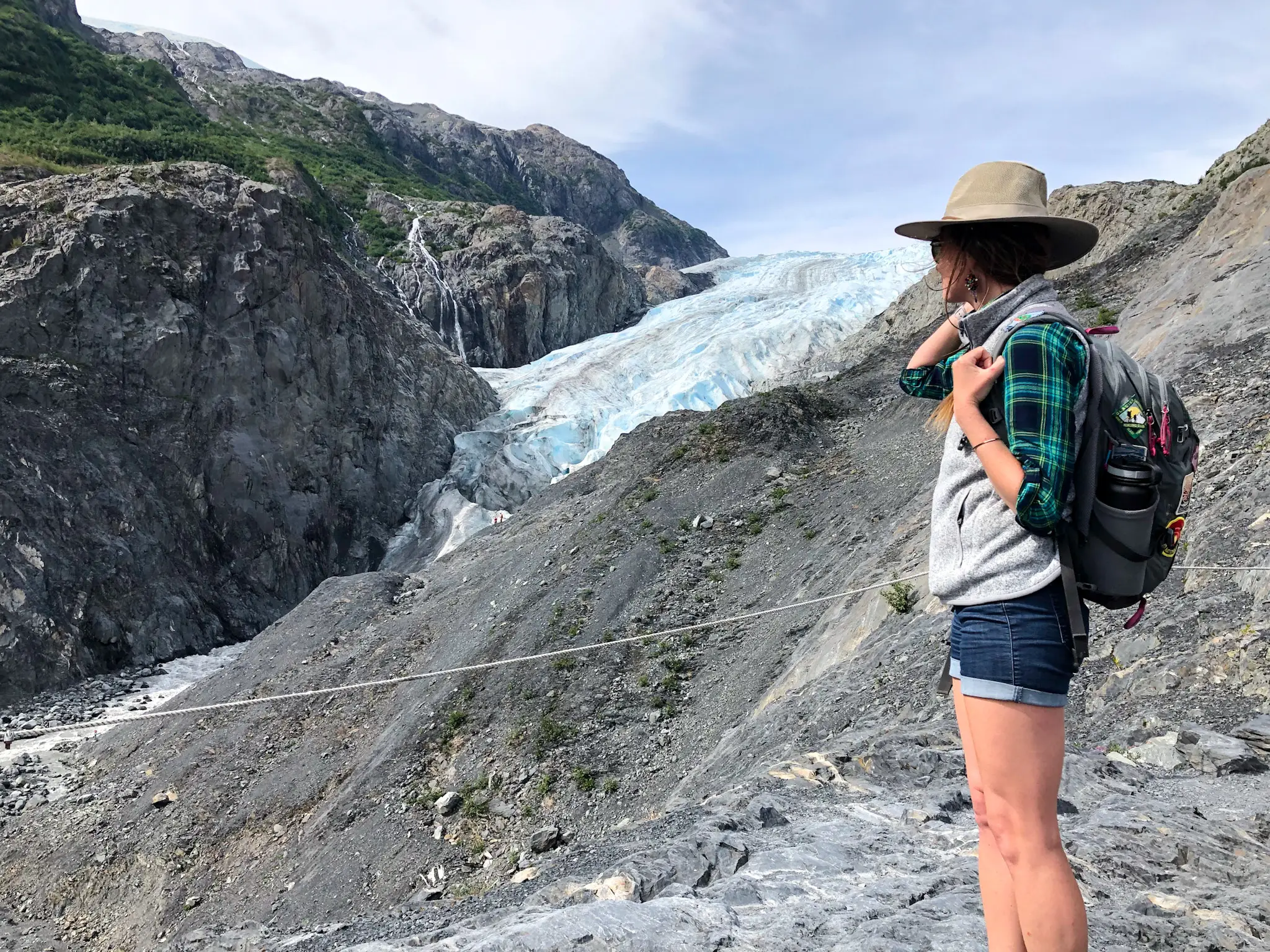Emily looks out at rock formations and glaciers in Kenai Fjords National Park.