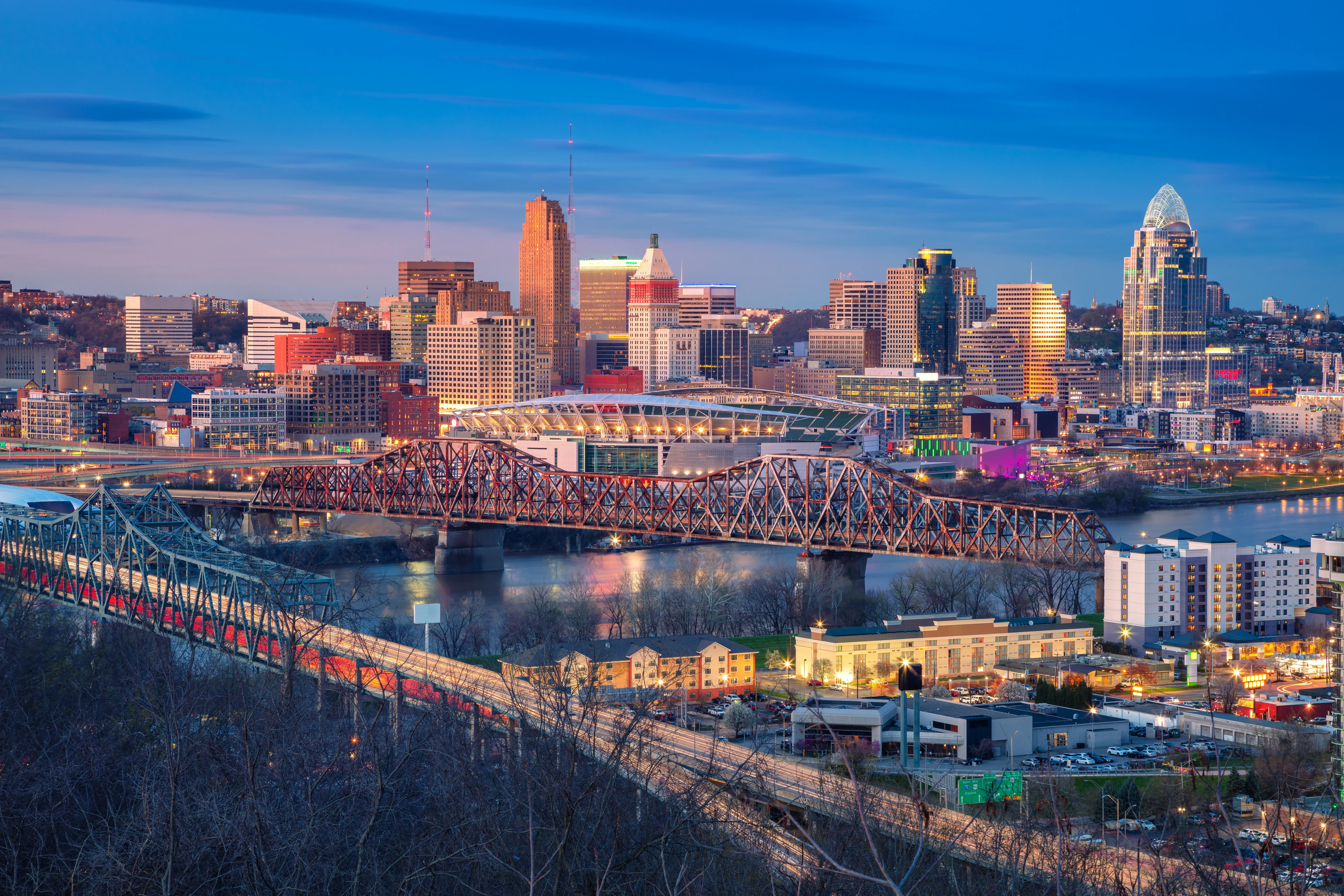 Cincinnati, Ohio, USA. Aerial cityscape image of Cincinnati, Ohio, USA downtown skyline with bridges and Ohio River at spring sunset.