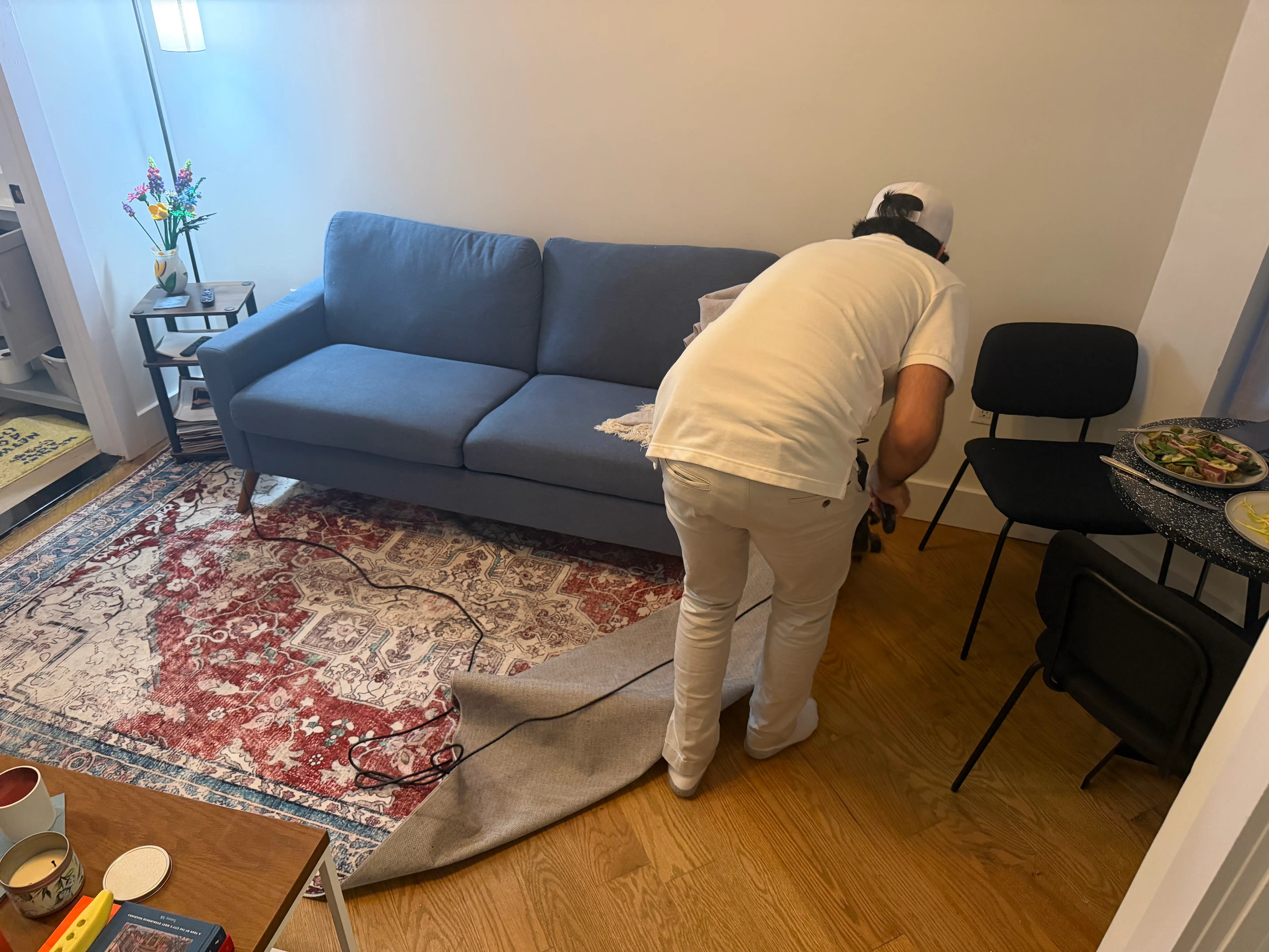 A Shift cleaner is pictured vacuuming.