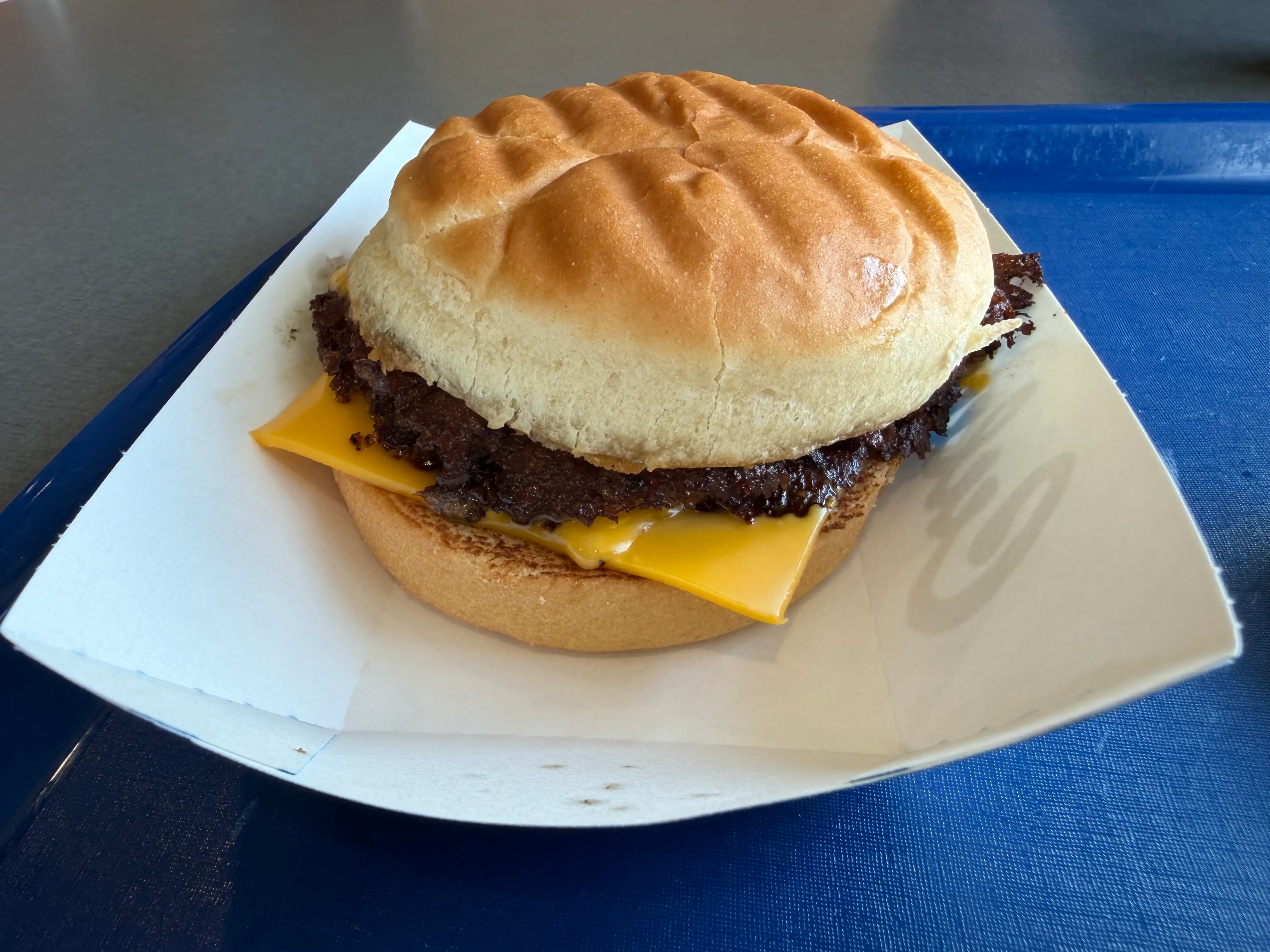 Culver's burger with cheese on cardboard tray