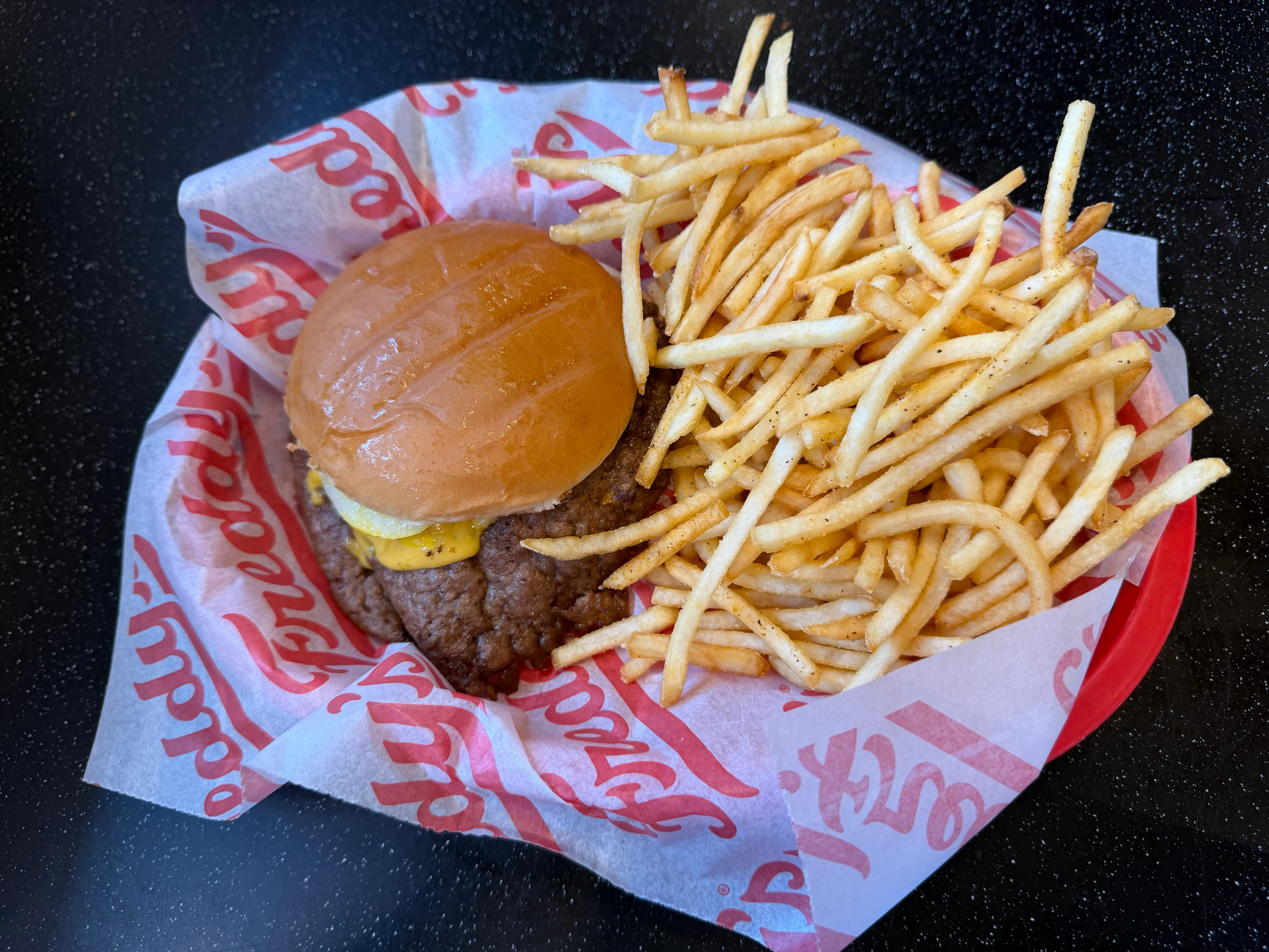 Tray with burger and fries at Freddy's