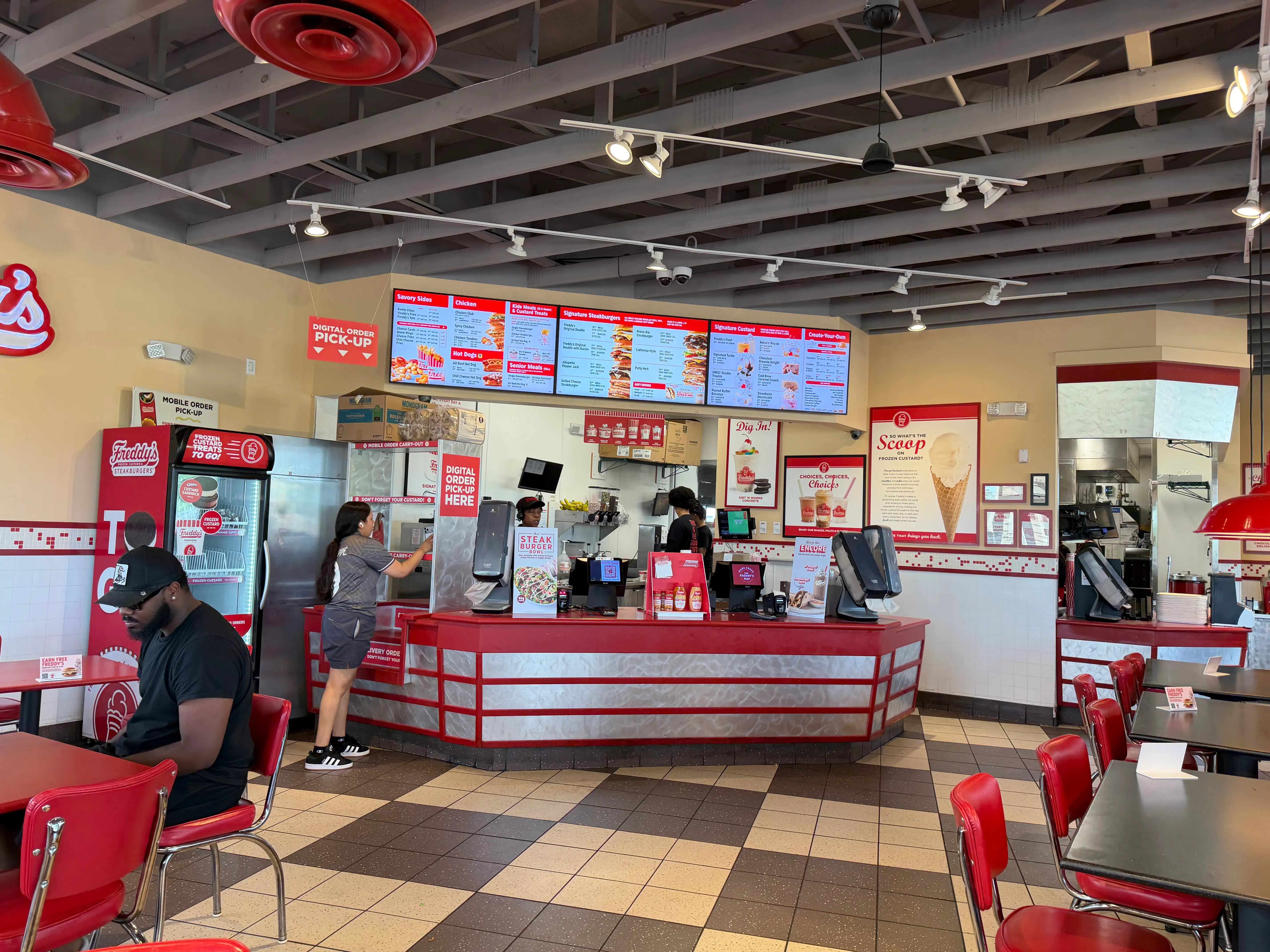 Retro-style red, white, and silver interior of a Freddy's location