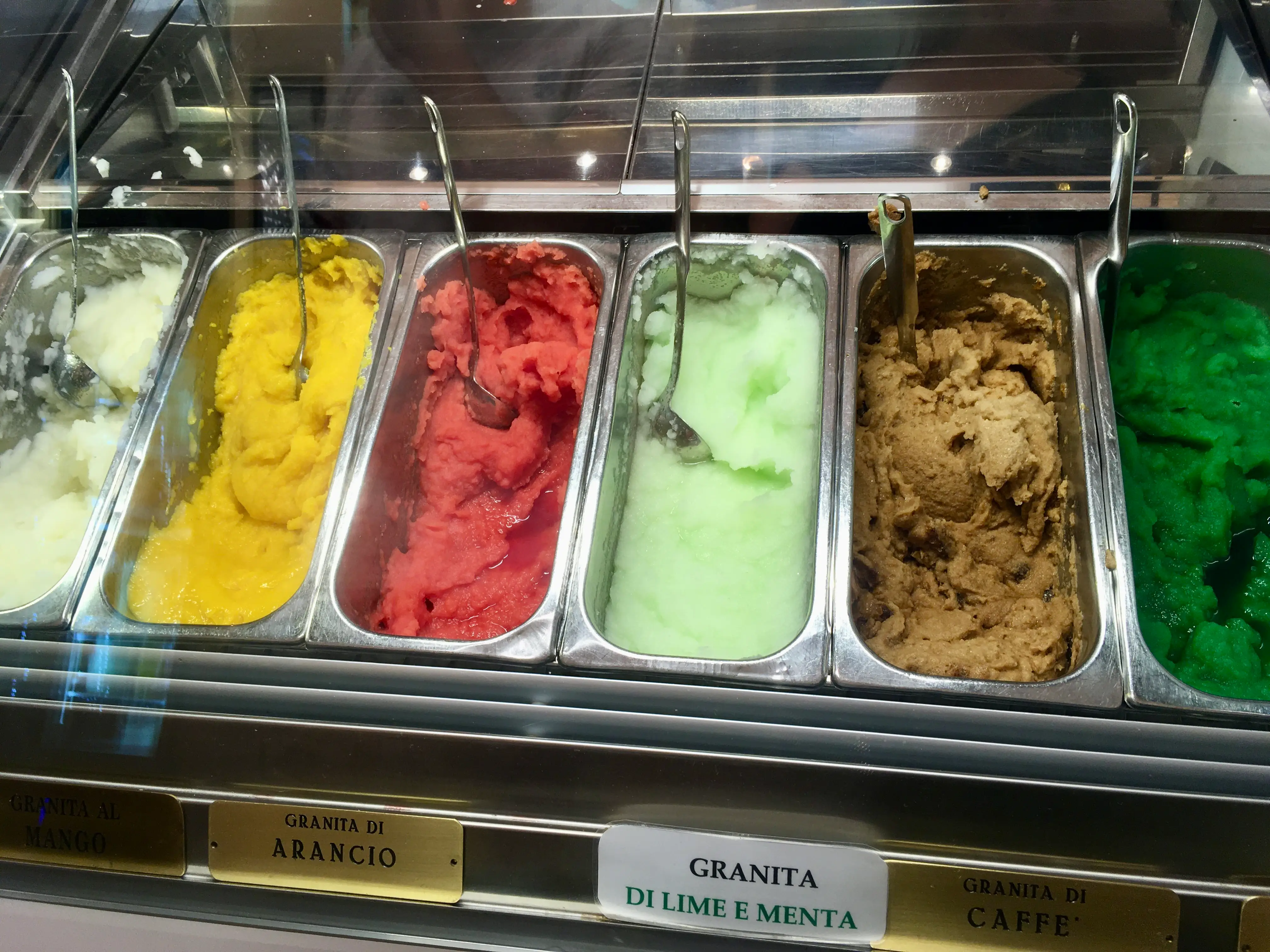 Six flavors of granita in a case.
