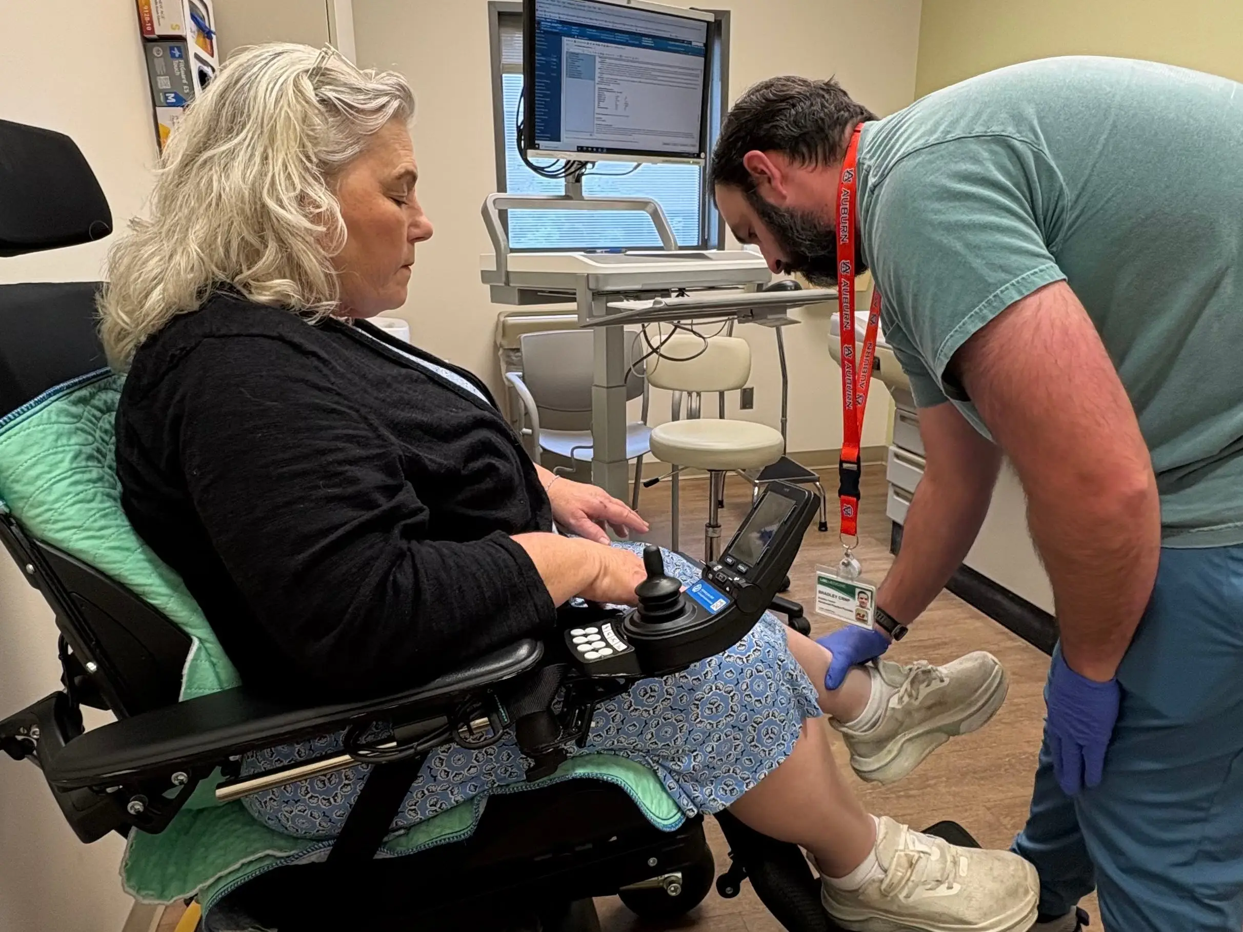 An older woman having a medical exam of her feet,
