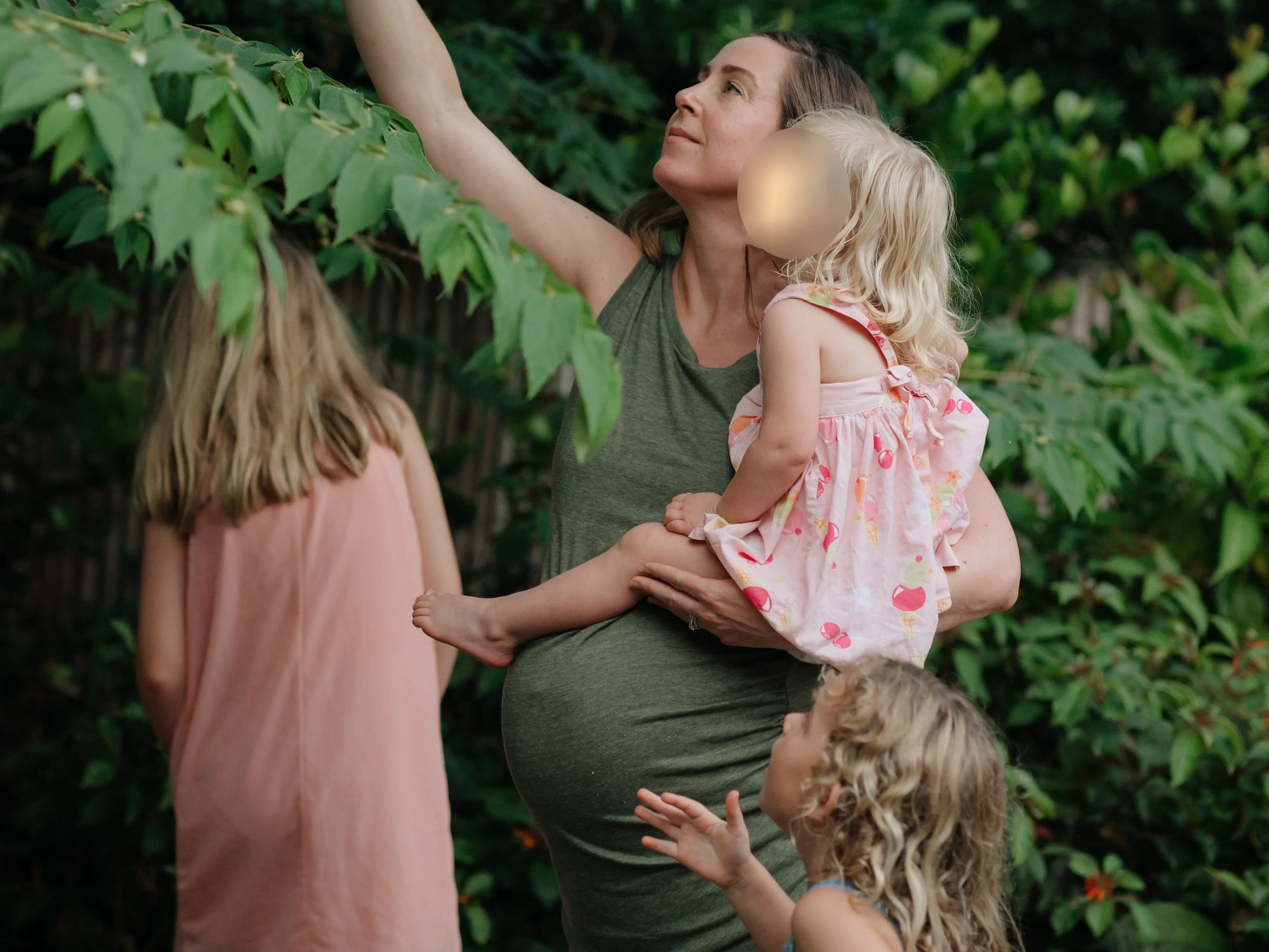 mom holding kids