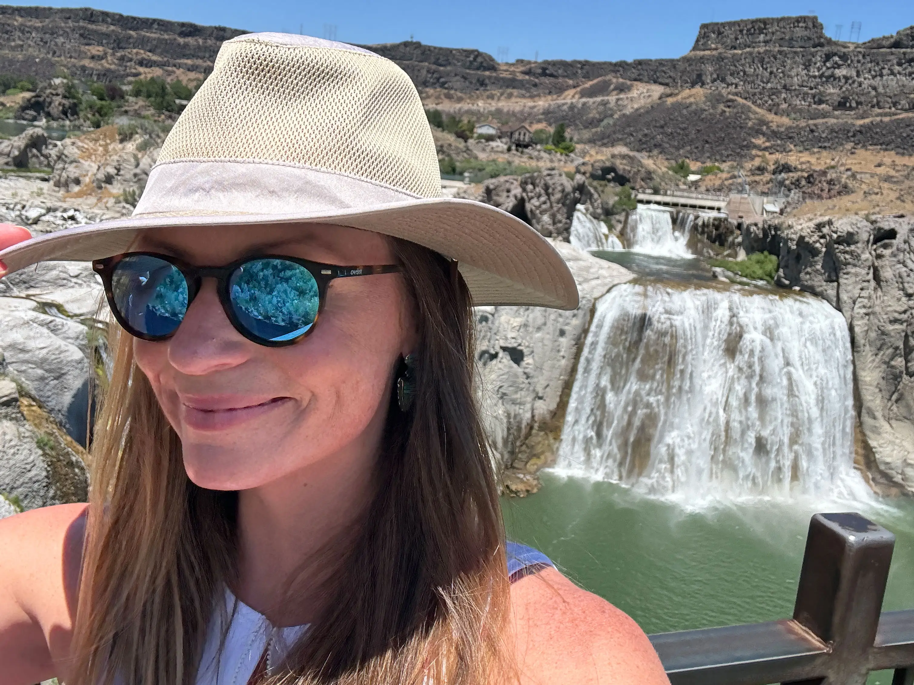 Emily poses in front of Shoshone Falls in Idaho.