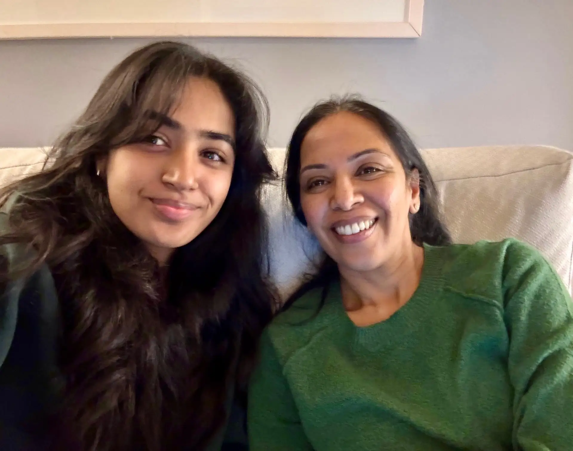 Mom and daughter posing for photo
