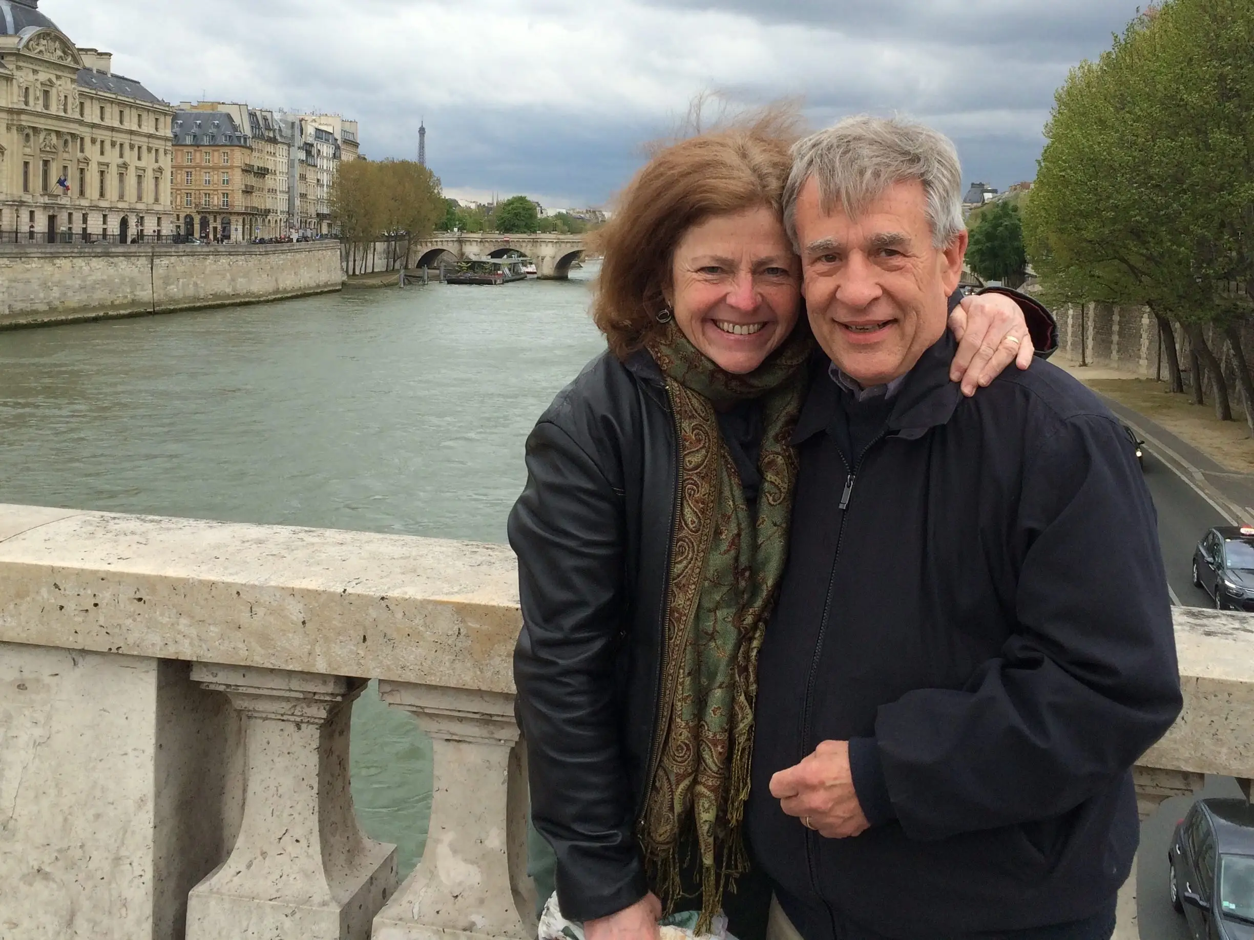 Husband and wife posing for photo