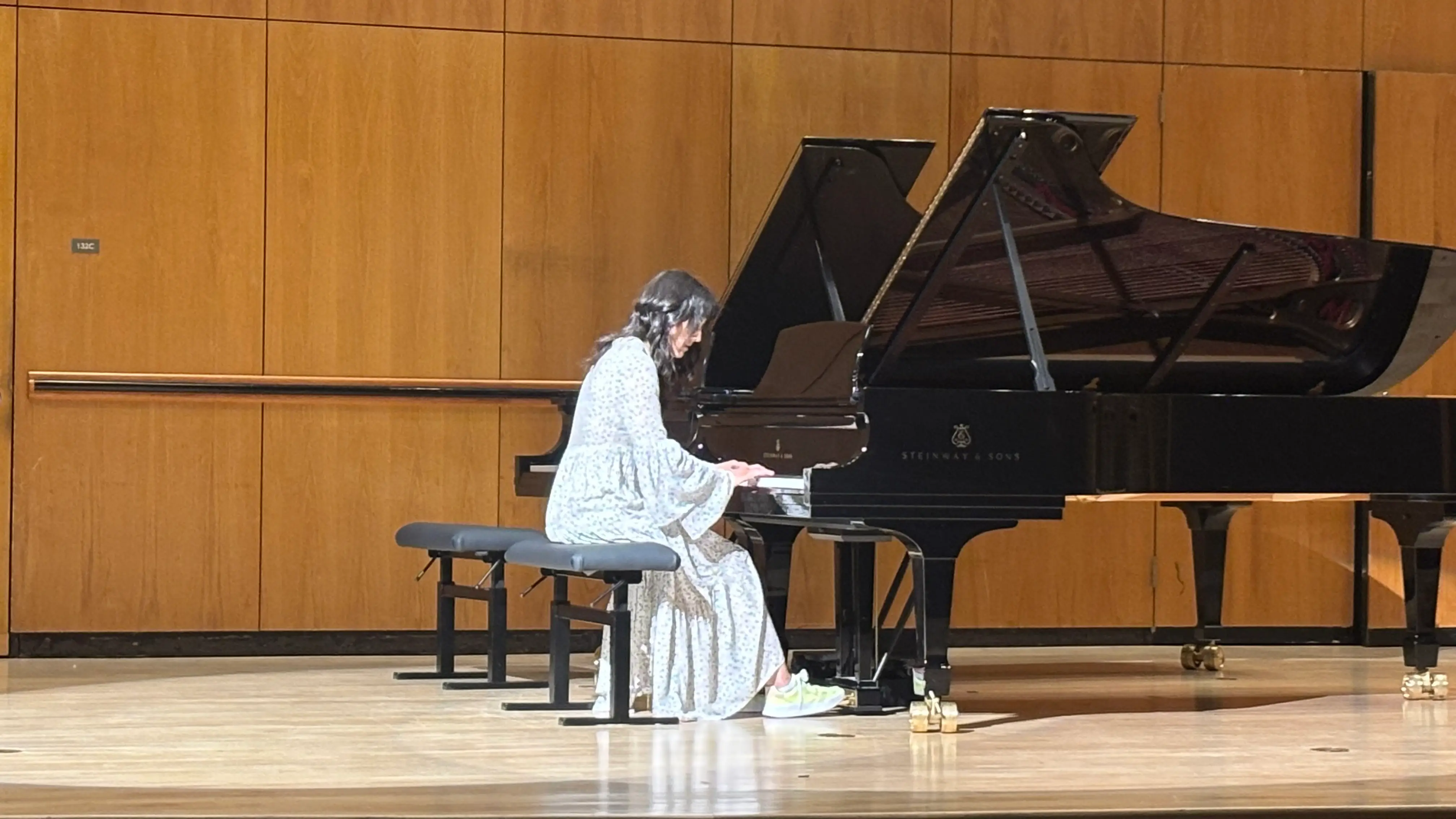 The author playing at her piano recital.