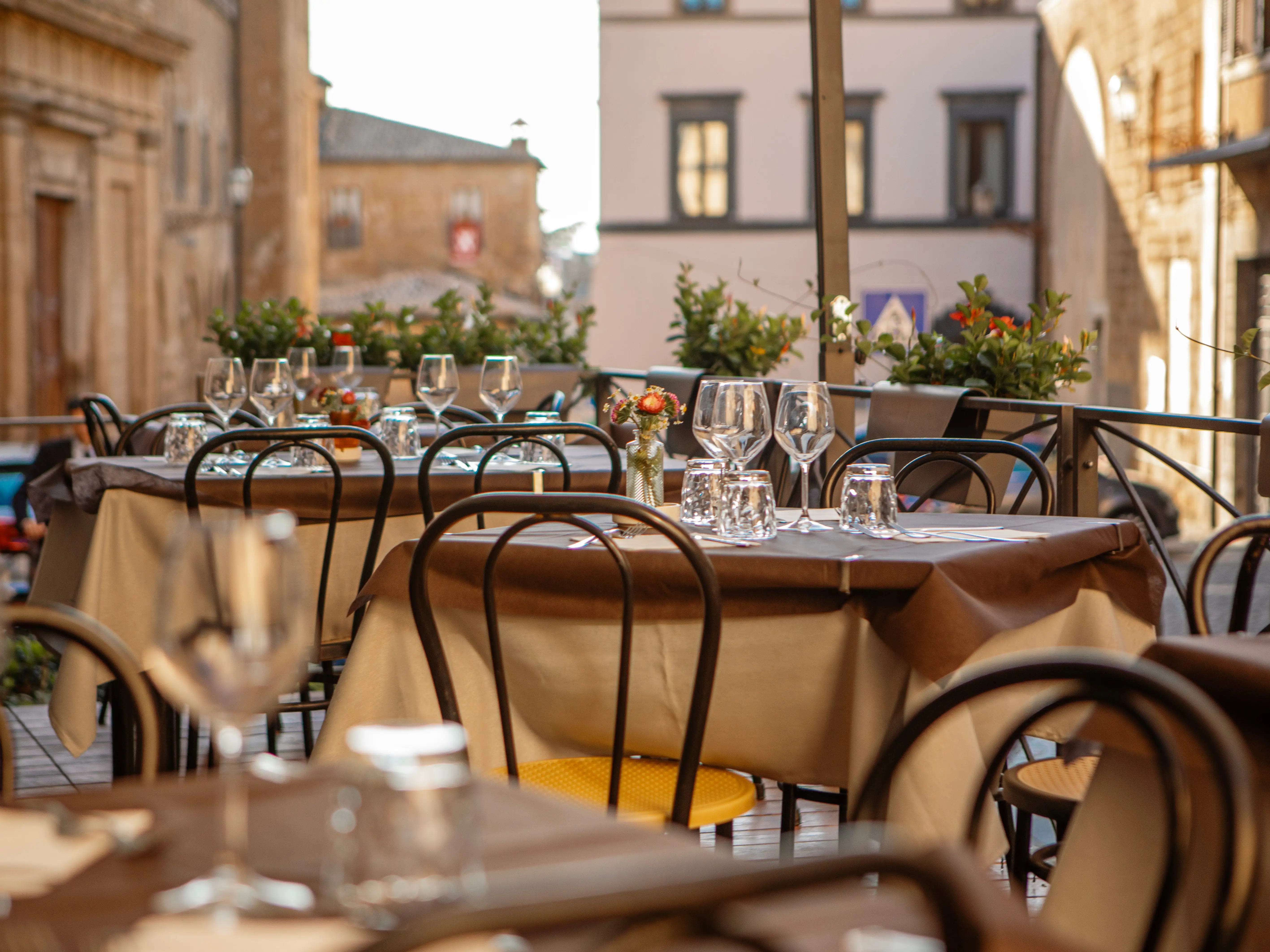An empty rooftop restaurant at dusk.