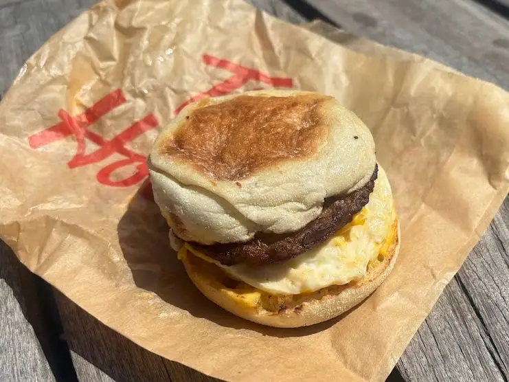 A sausage, egg, and cheese sandwich on an English muffin.