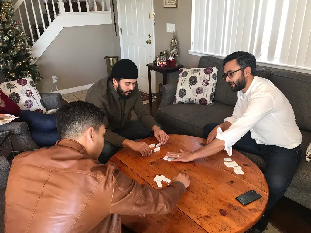 Adult men playing domino
