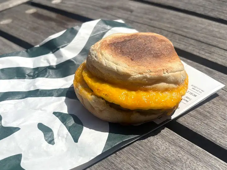 A sausage, egg, and cheese sandwich on an English muffin.