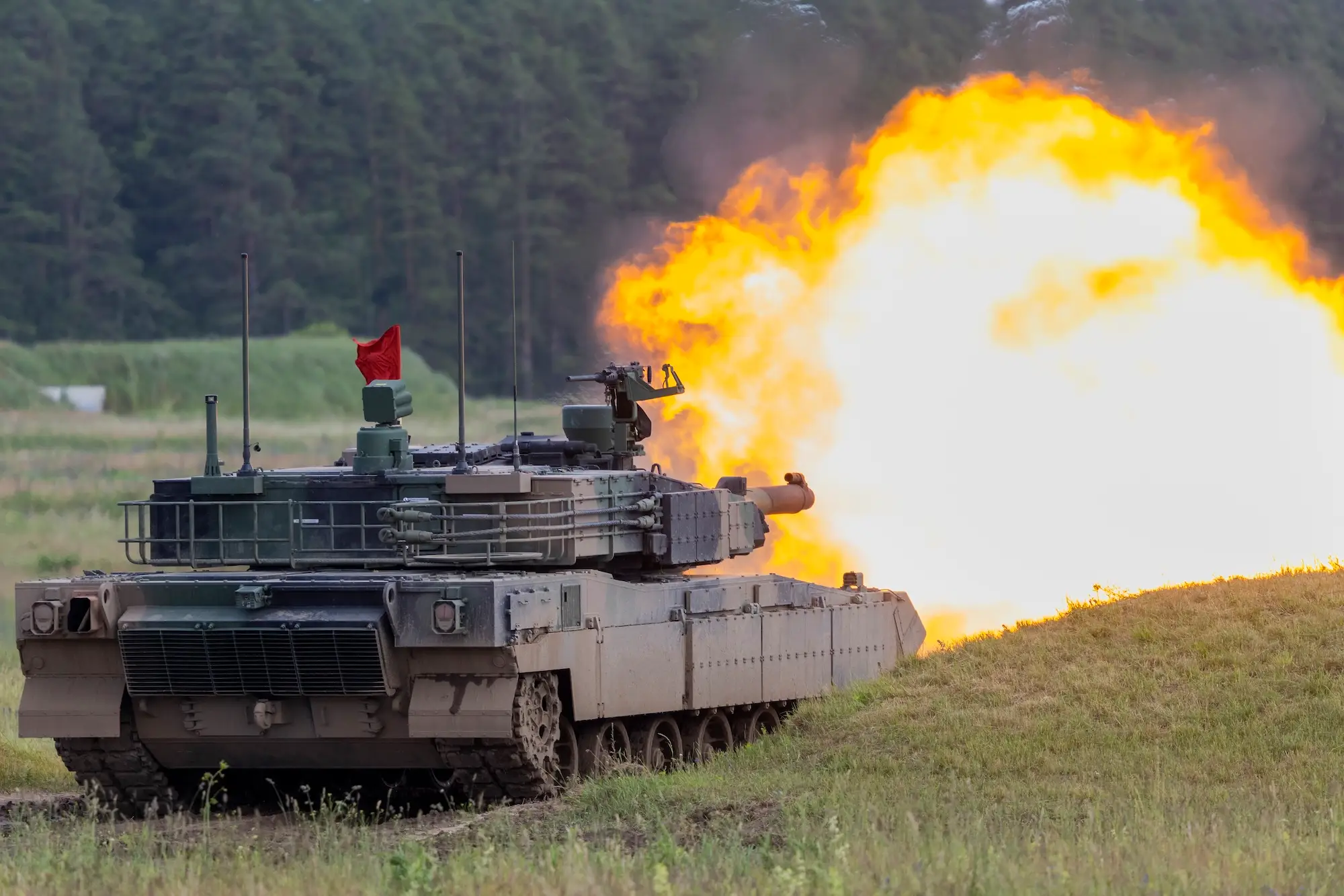 A Polish Army tank fires during an exercise near the Suwalki Gap in June 2026. Poland depends on force size to deter neighboring Russia.