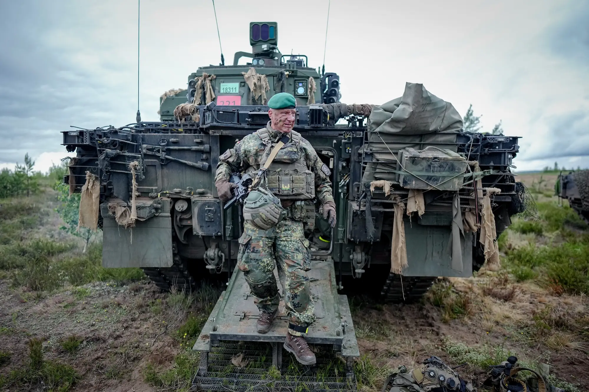 Brig. Gen. Christoph Huber of the German Army emerges from a Puma infantry fighting vehicle during the Freedom Shield 2026 exercises in Lithuania in June.