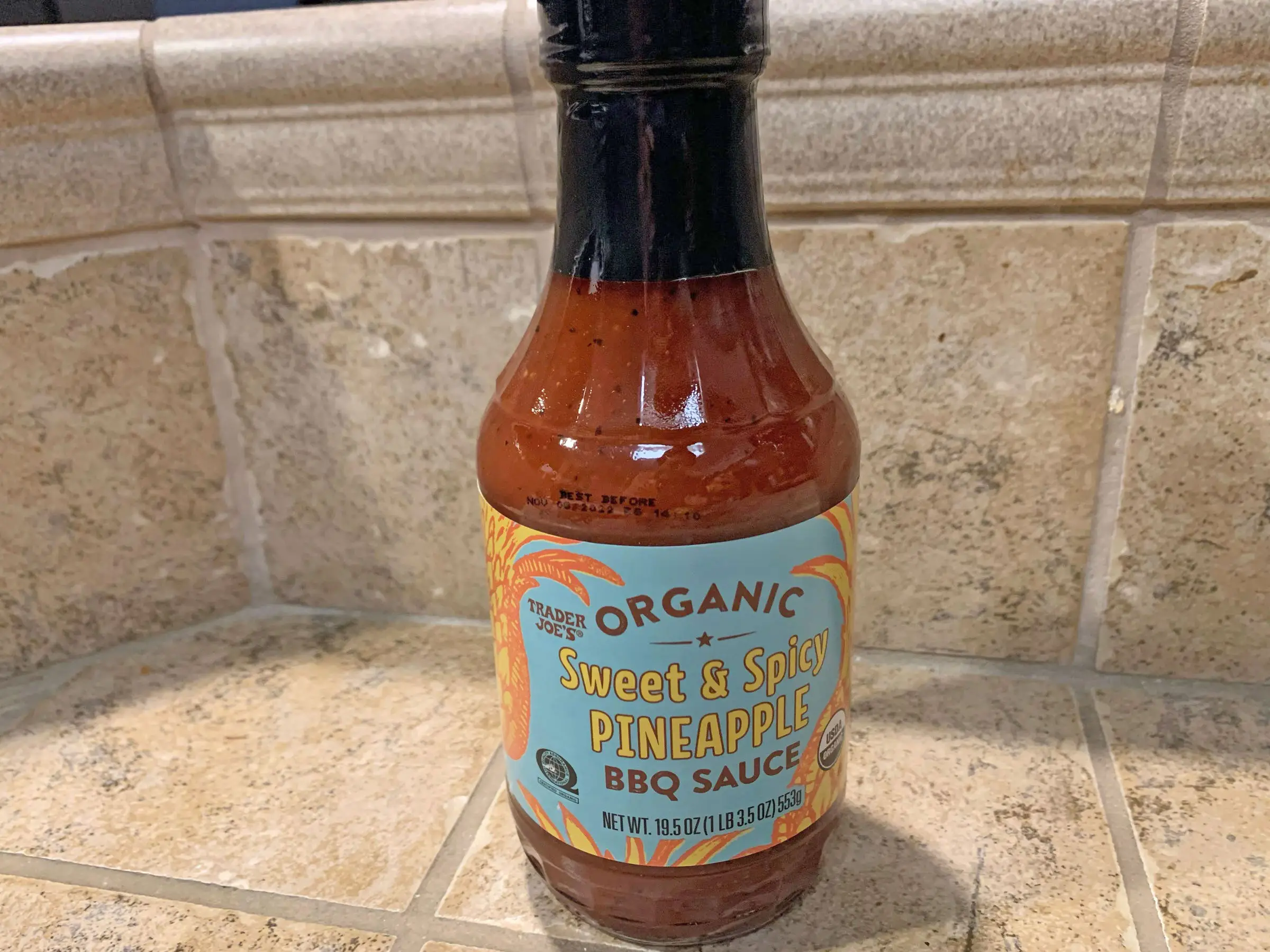 A bottle of Trader Joe's pineapple barbecue sauce.