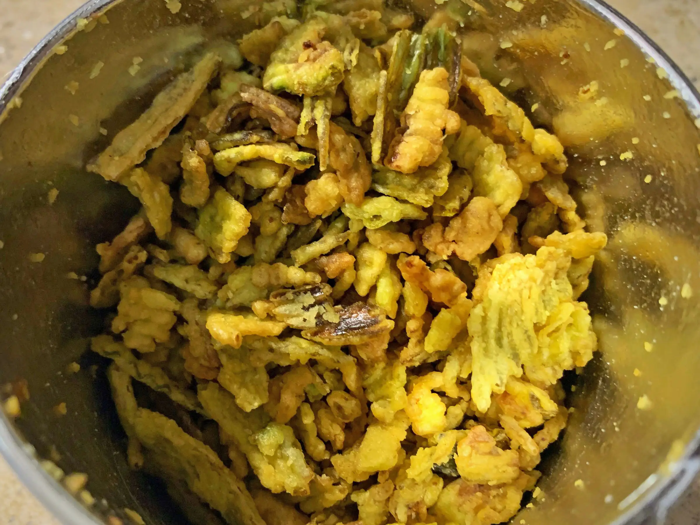 Trader Joe's crispy jalapeño pieces inside the container.
