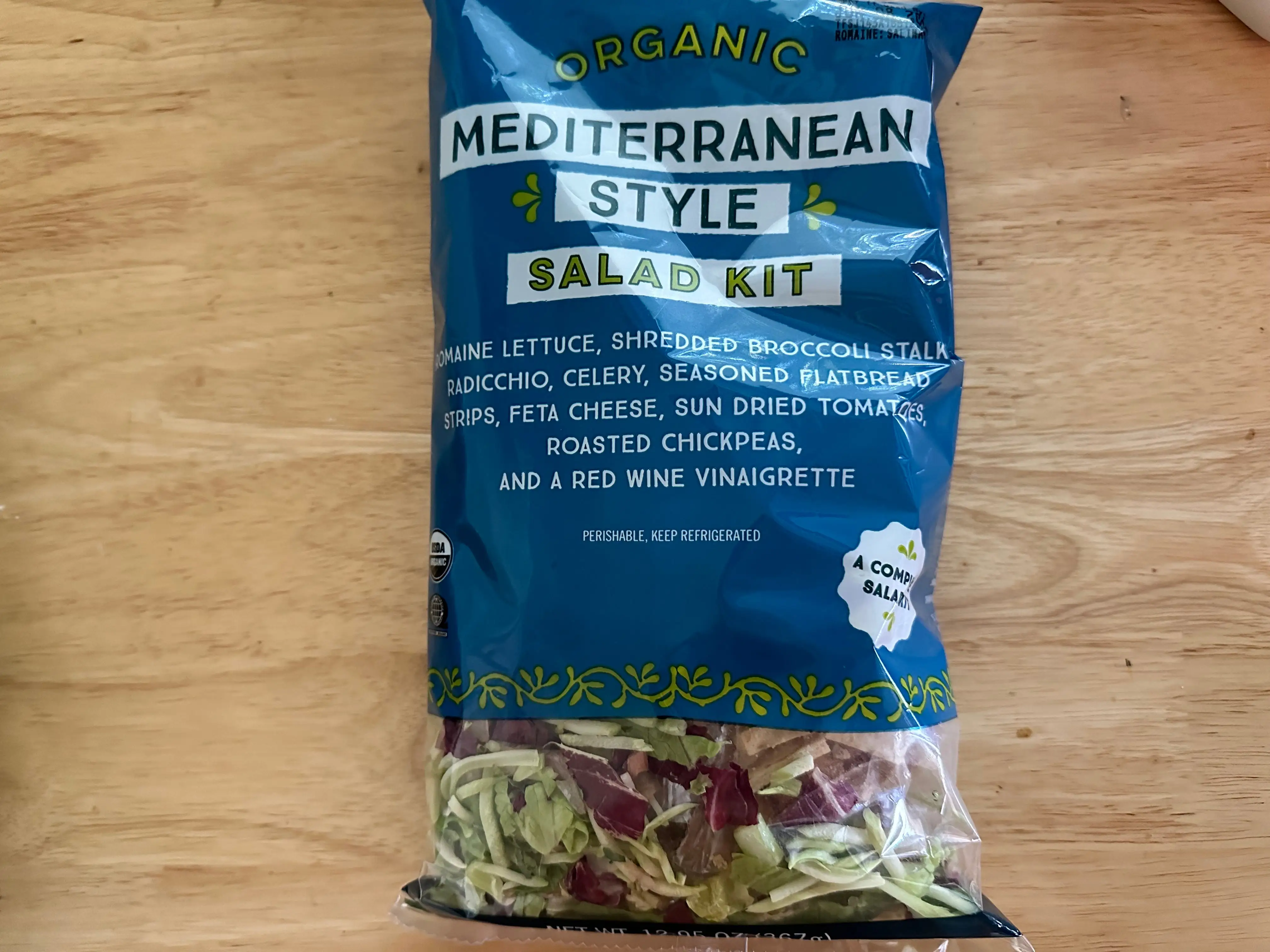 Trader Joe's Mediterranean-style salad kit in blue bag.