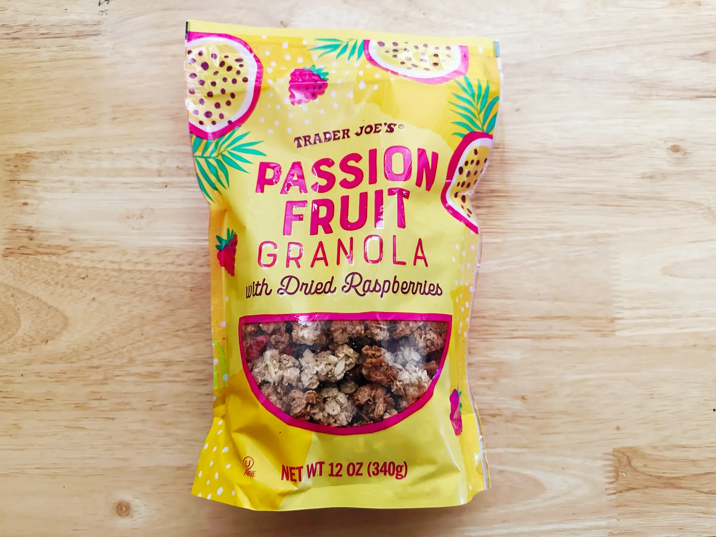 A bag of Trader Joe's passion-fruit granola with dried raspberries.
