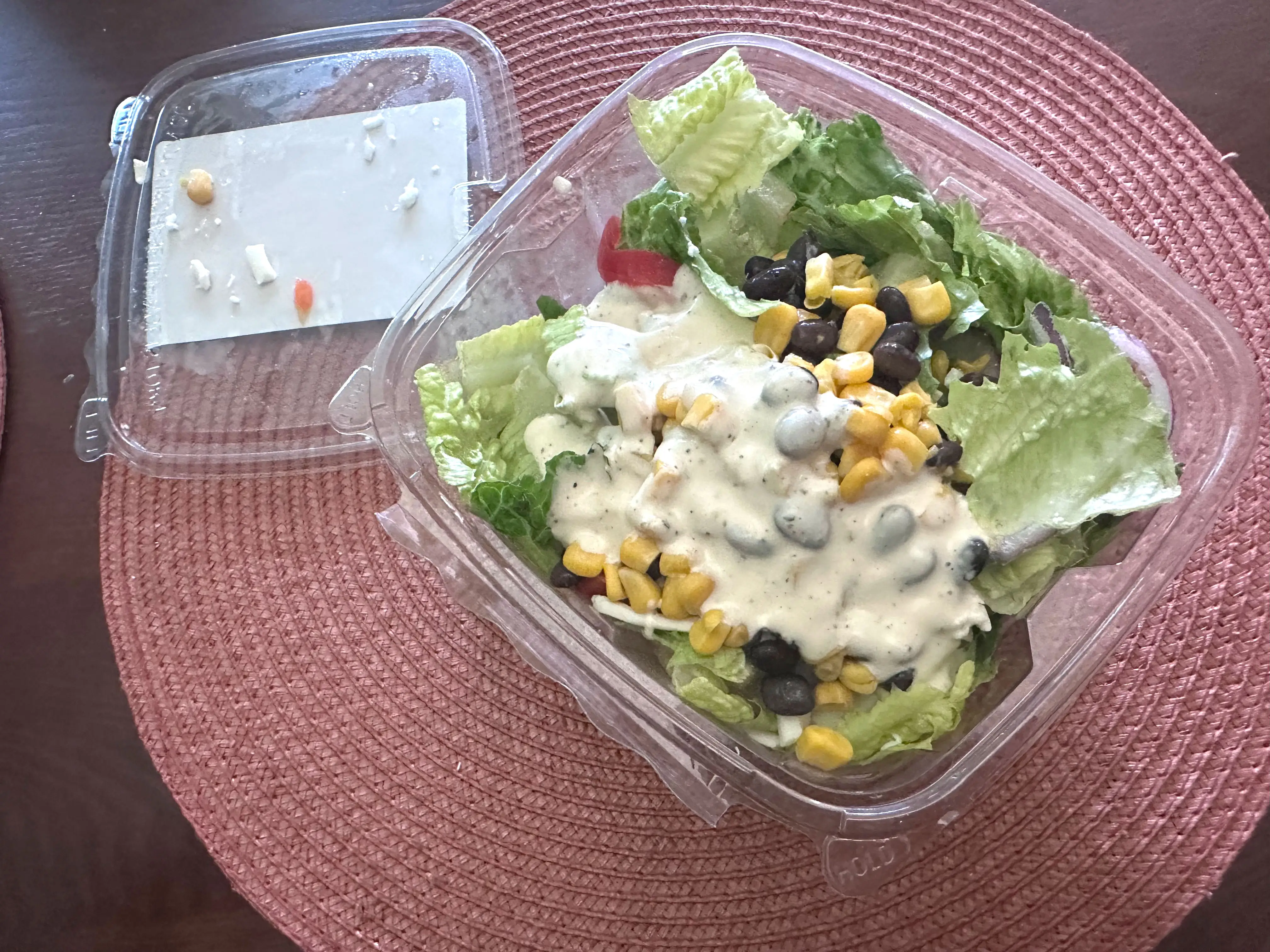 An open container of Trader Joe's salad with barbecue-chicken-flavored chicken.