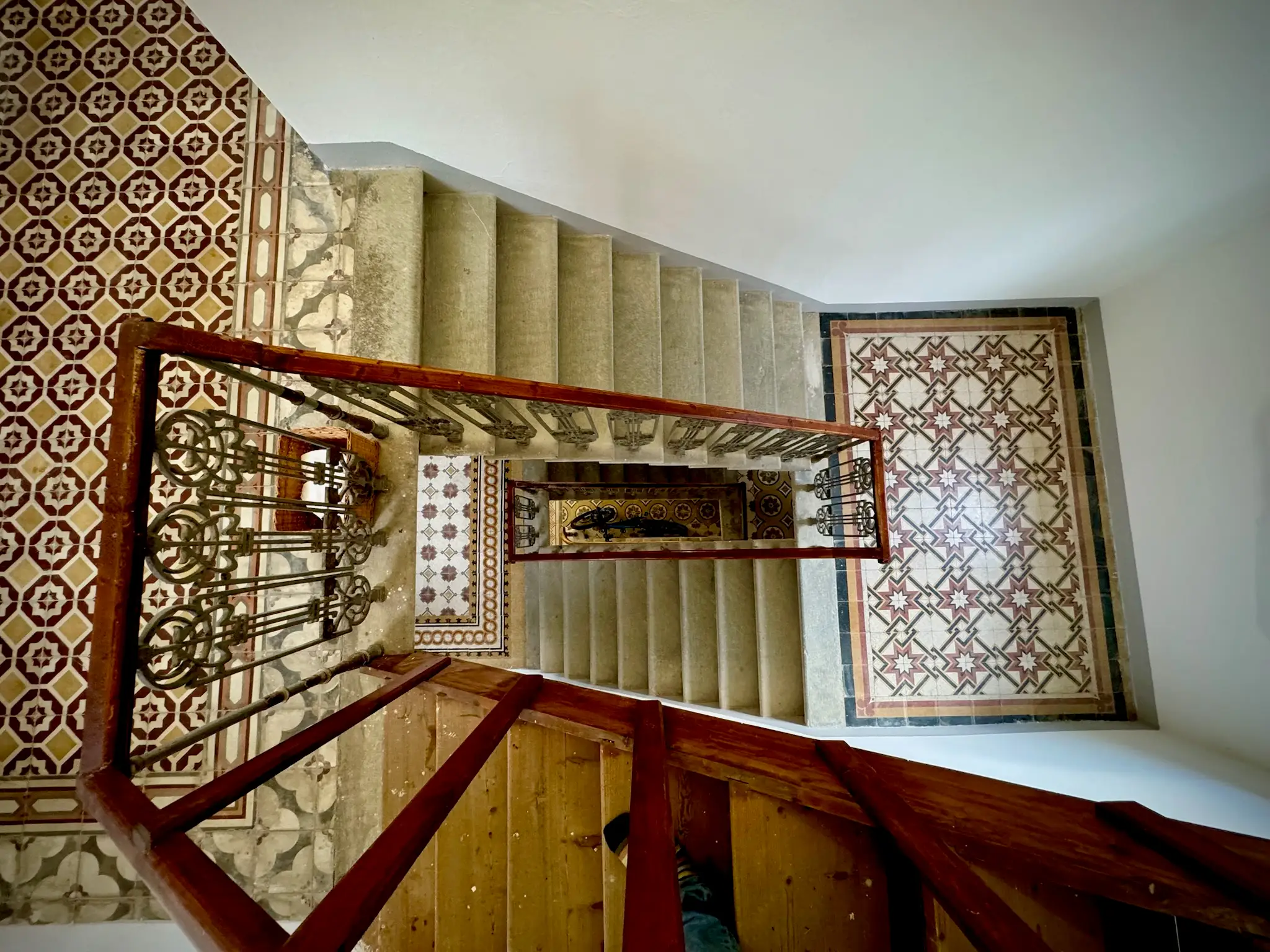 Aerial view of spiral staircase with colorful tiles