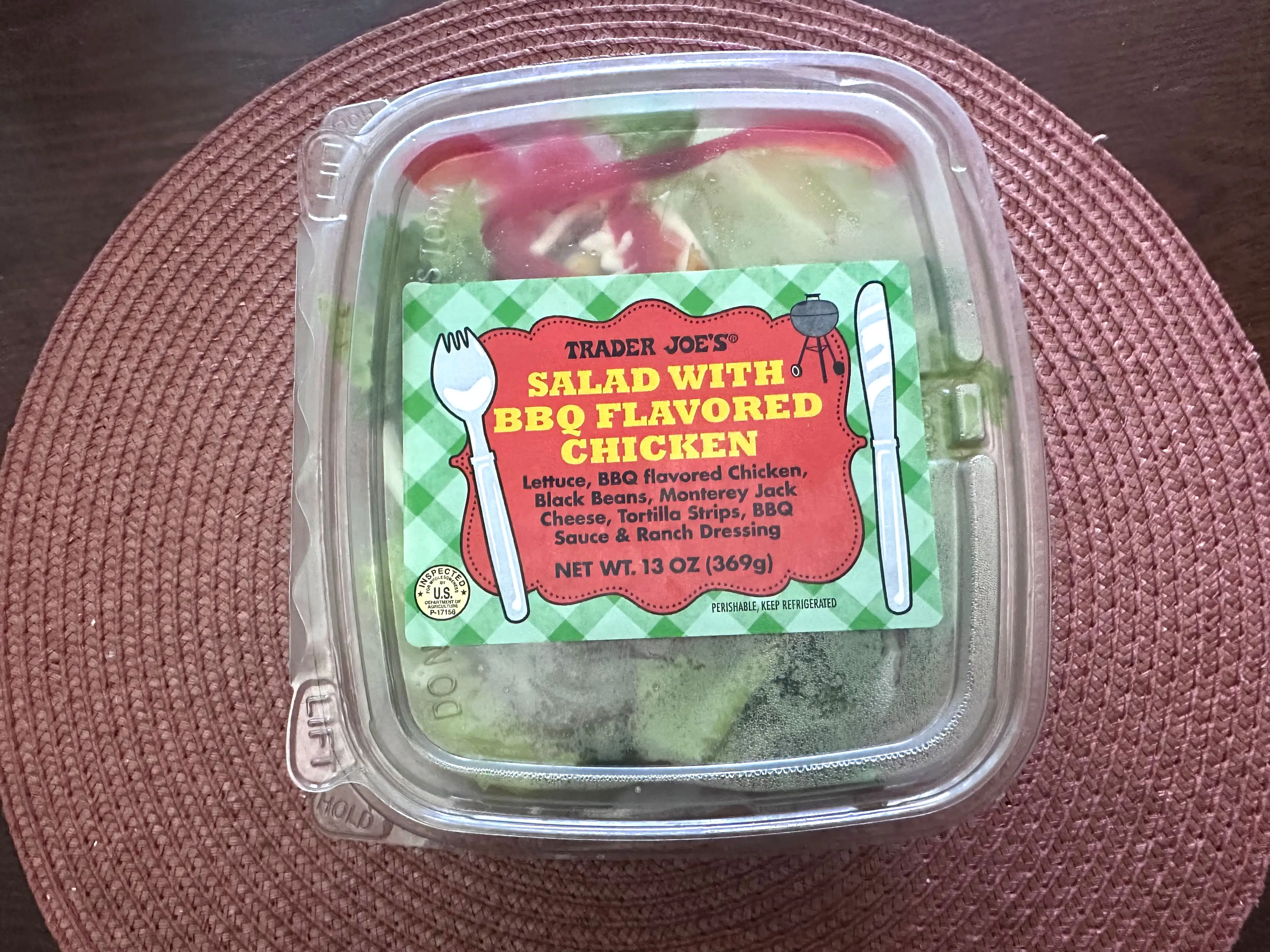 A container of Trader Joe's salad with barbecue-flavored chicken.
