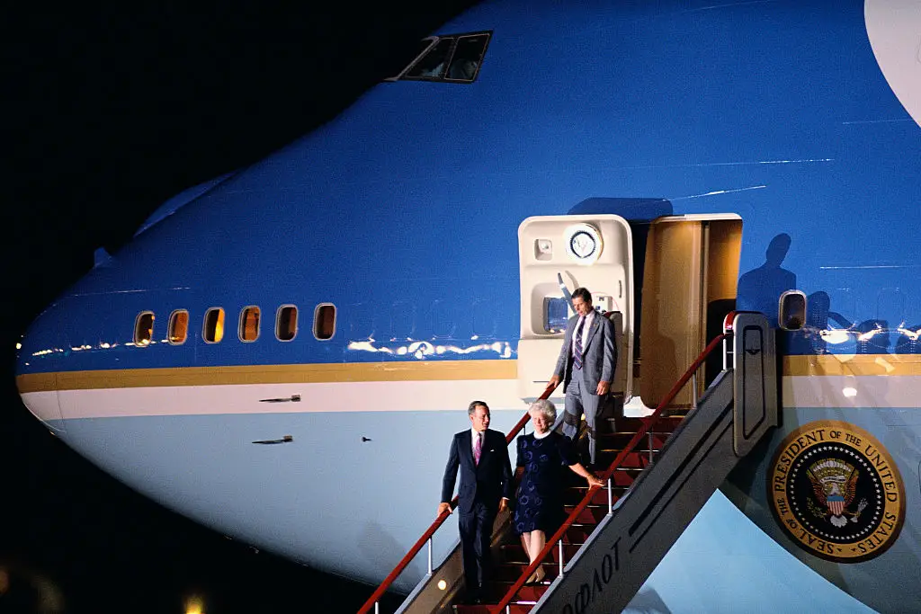 President George Bush and first lady Barbara Bush exit Air Force One in 1991.