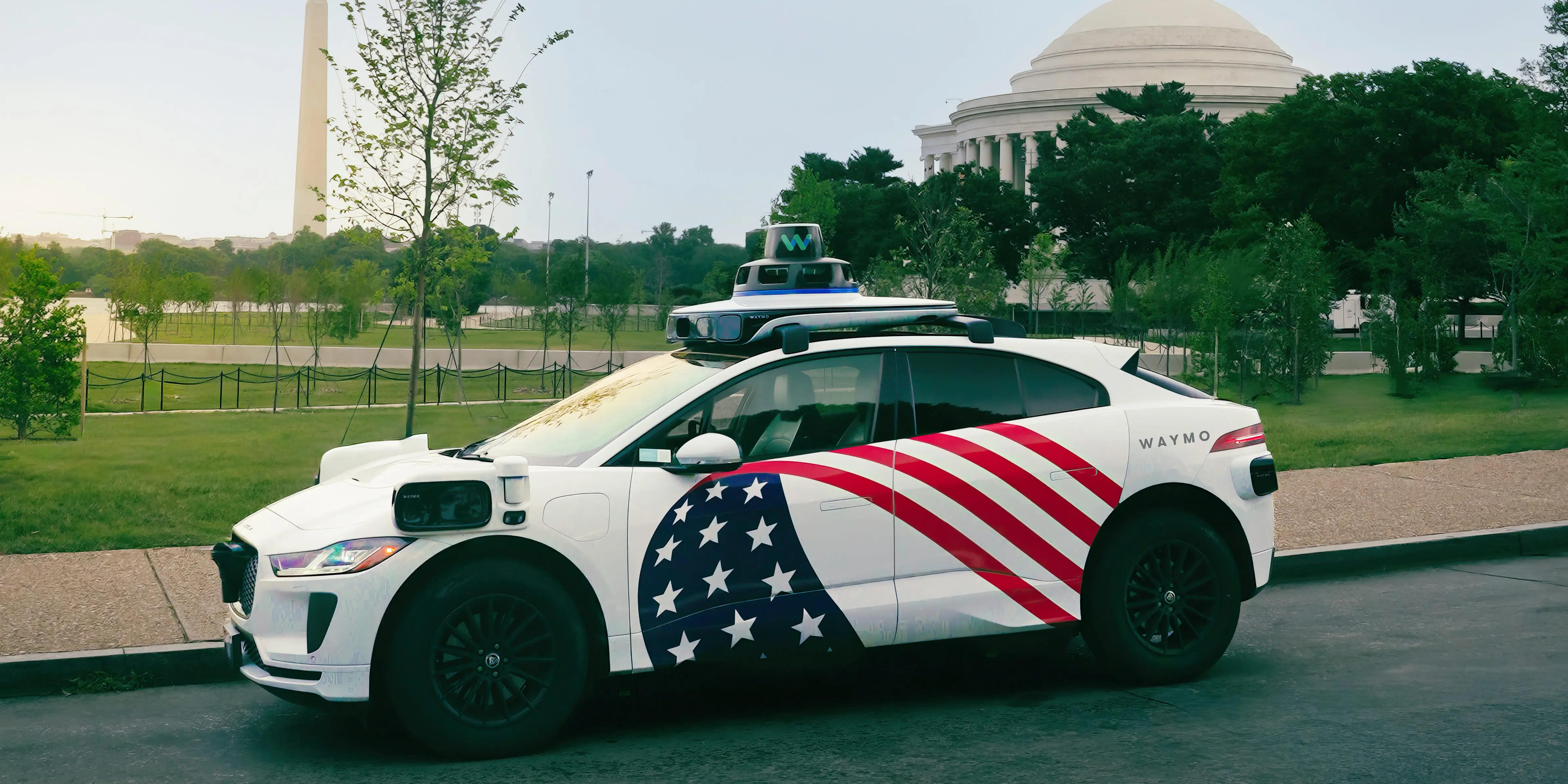 Waymo with an American flag
