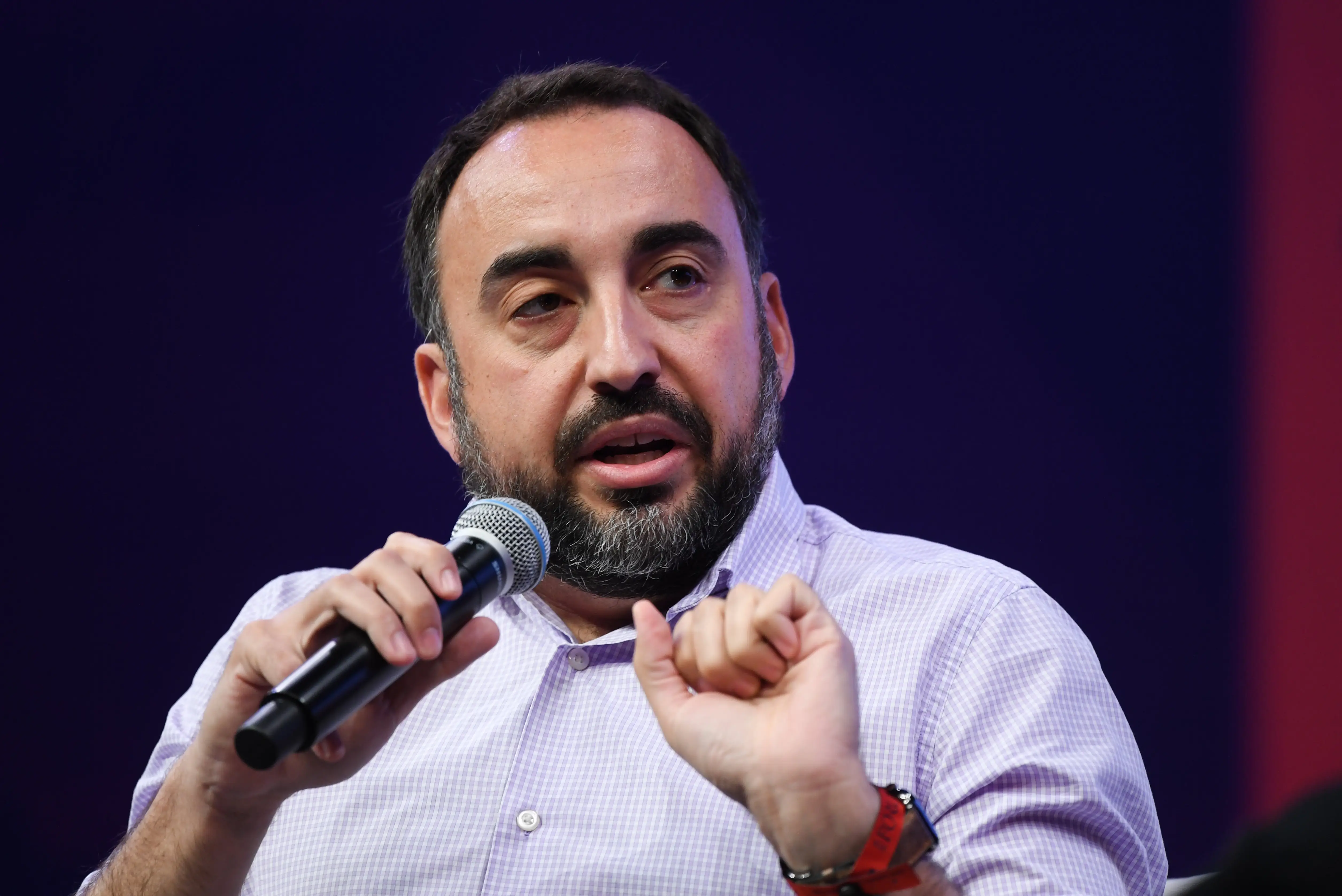 Alex Stamos holding a microphone