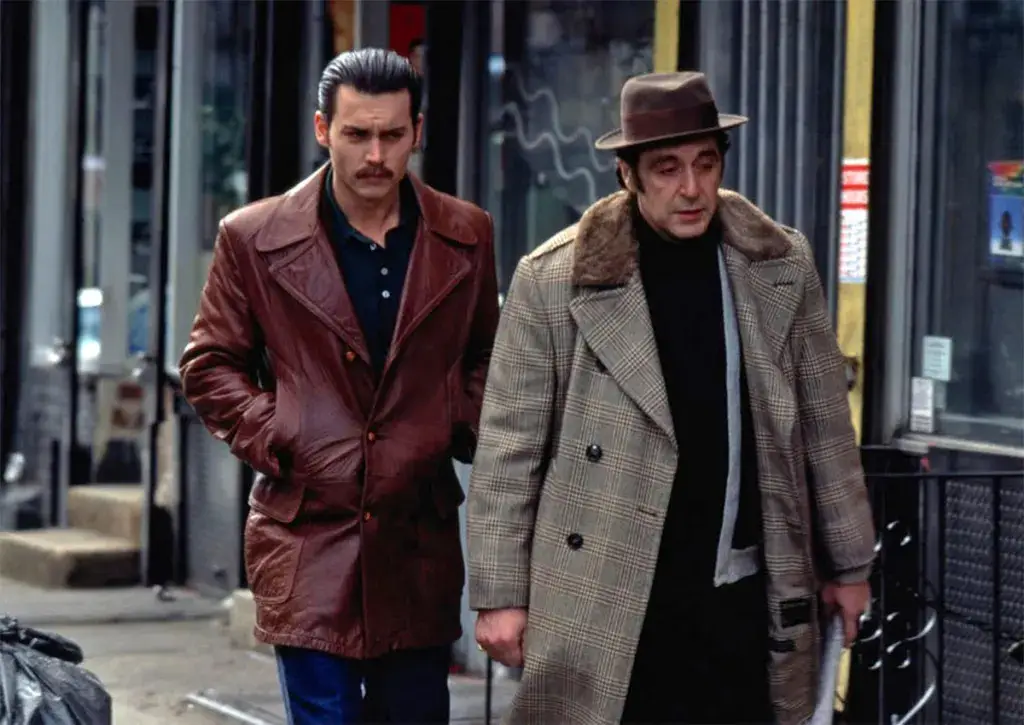 Johnny Depp and Al Pacino walking down the street in Donnie Brasco movie