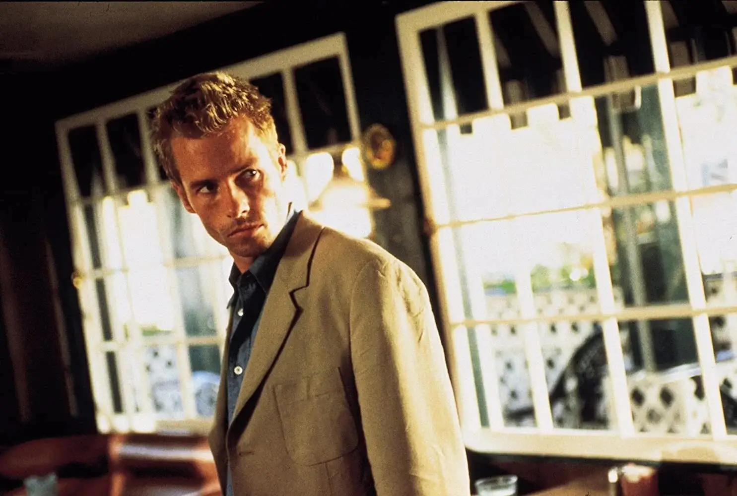 Guy Pearce standing in a restaurant
