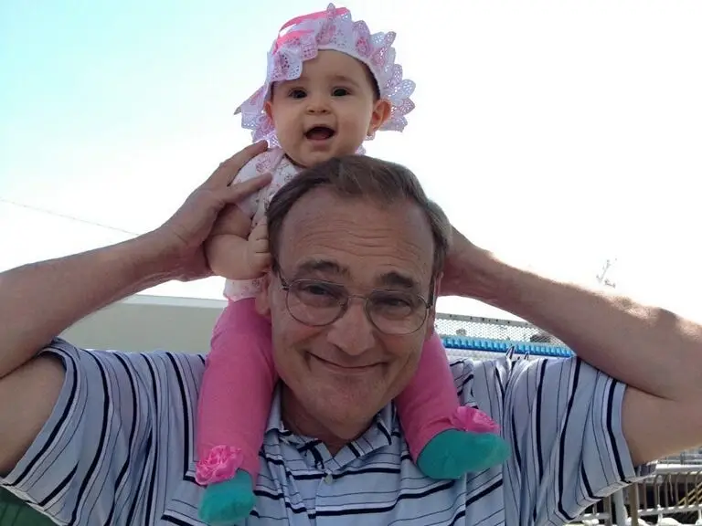 Daniel Allen's father holding his oldest daugther.