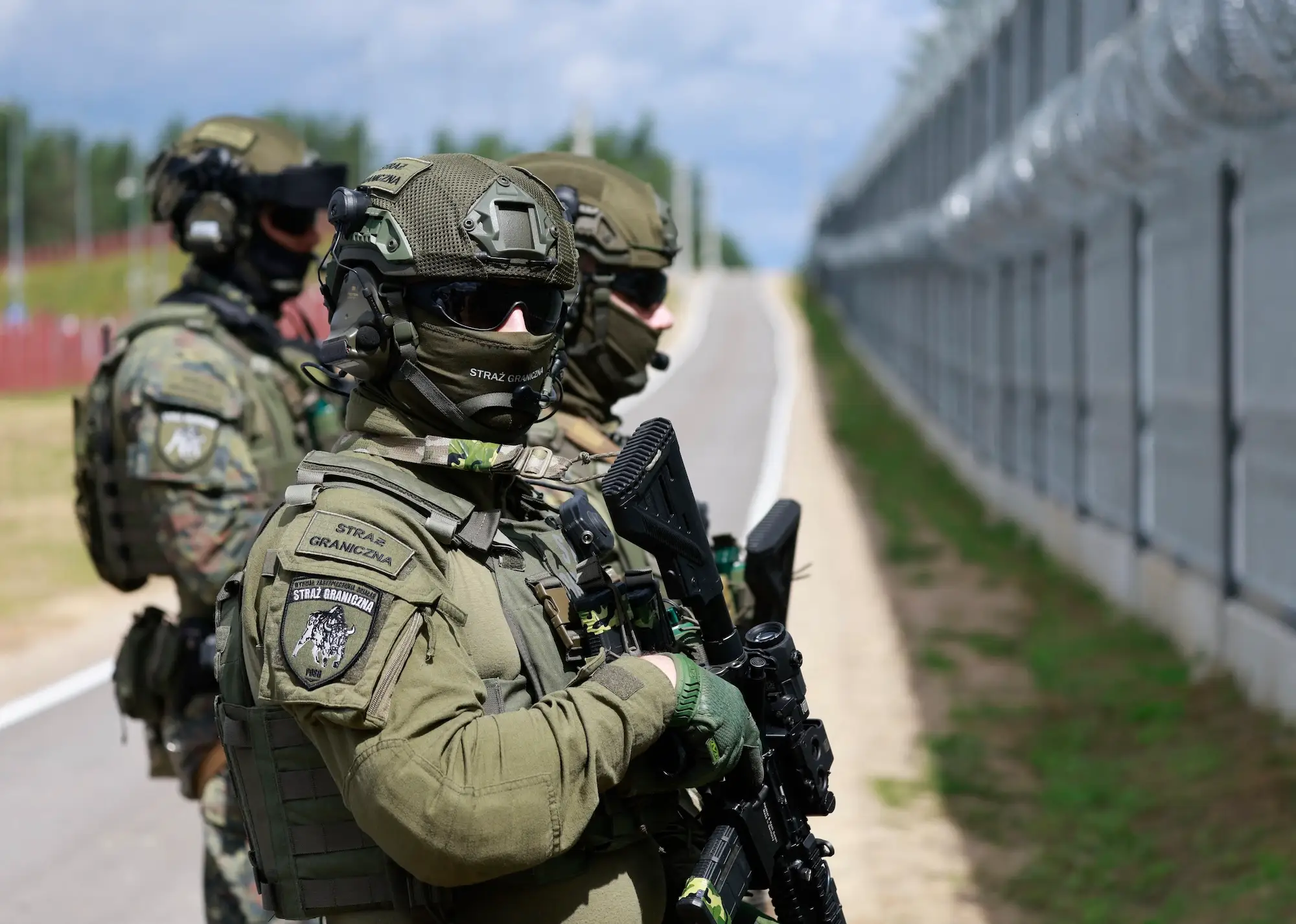 Border guards patrol a section of Poland's border with Belarus during a high-profile visit in June.