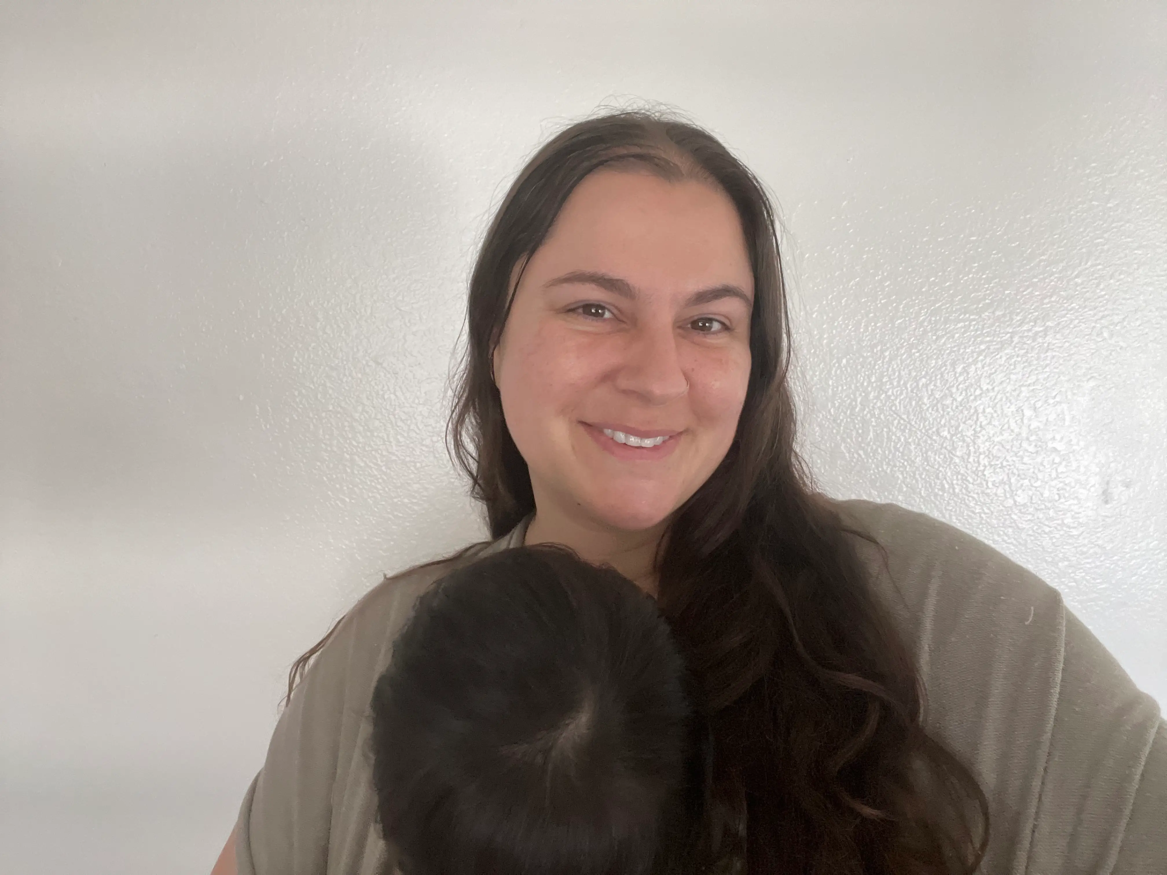 Woman smiling while holding baby