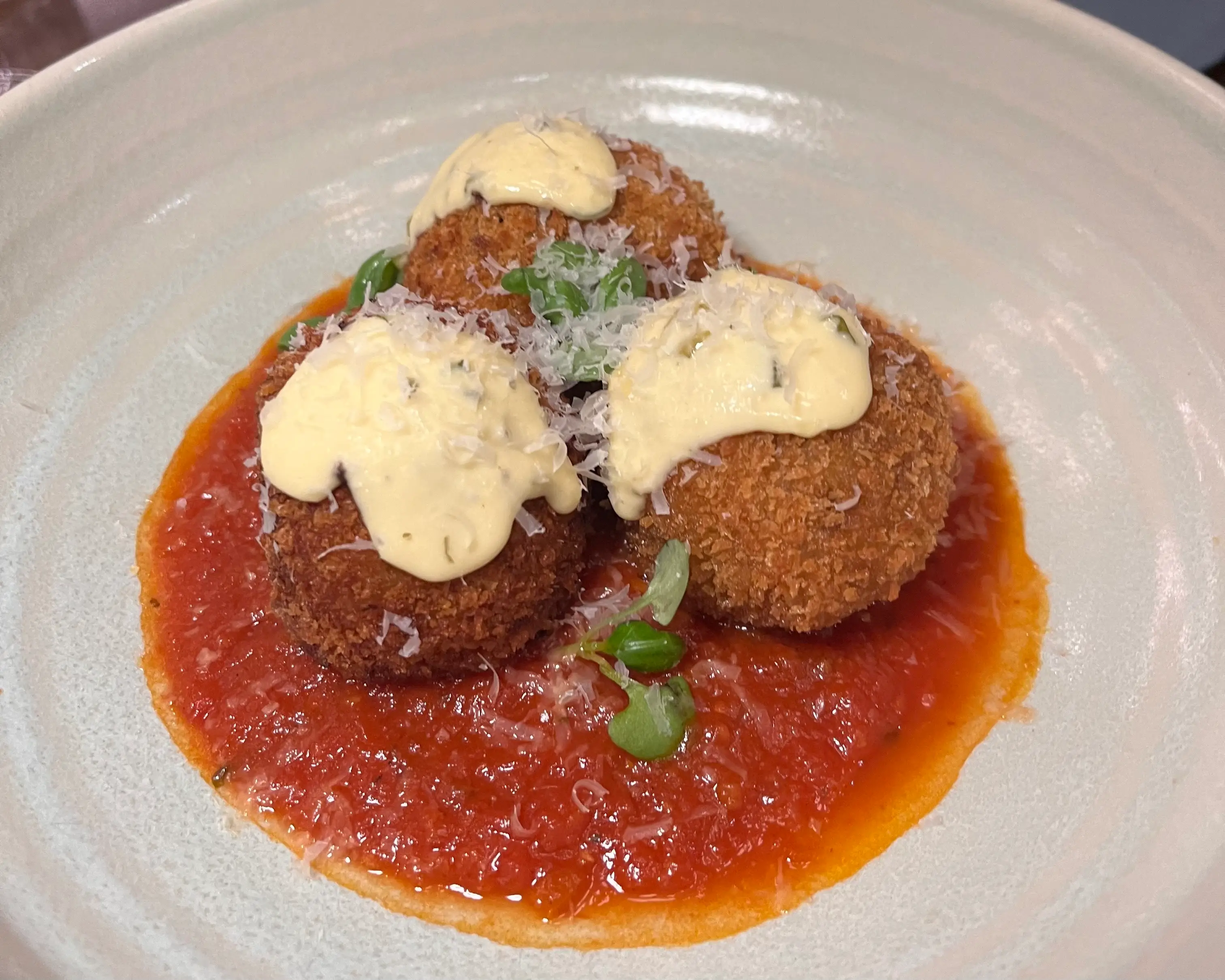 arancini balls in pool of