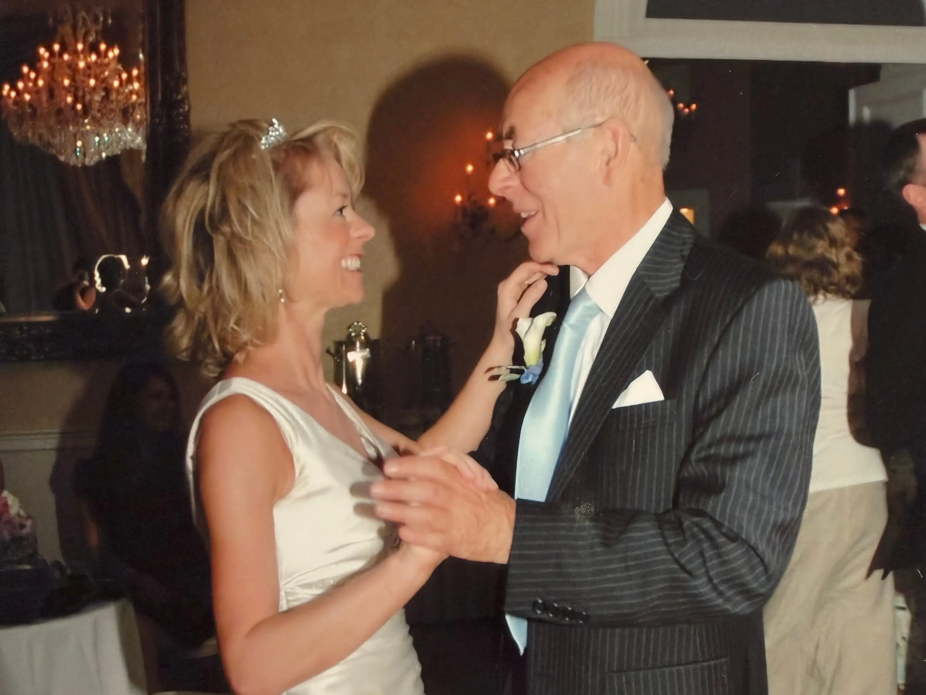 A bride dancing with her father at her wedding.
