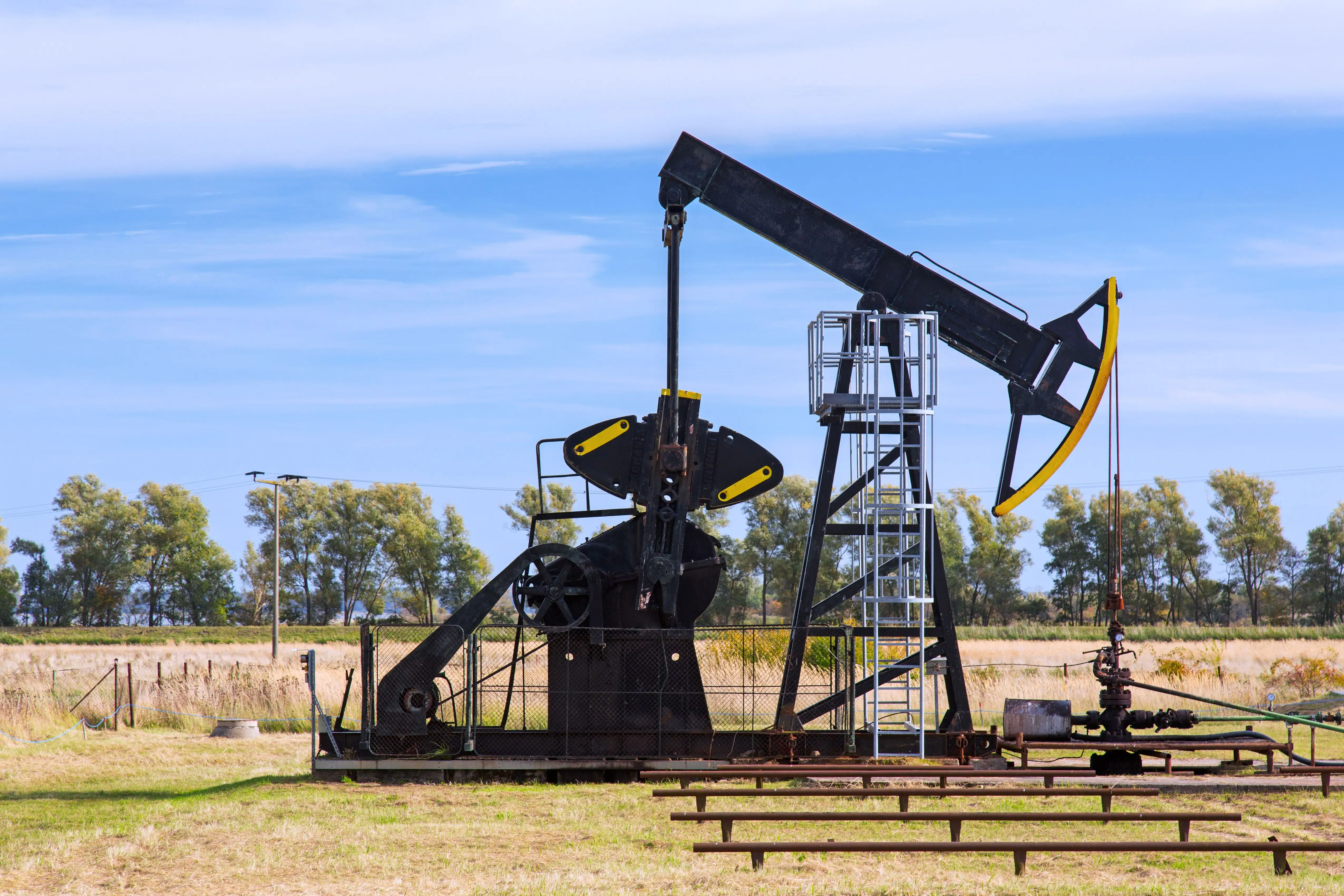 An oil pump in a grassy field