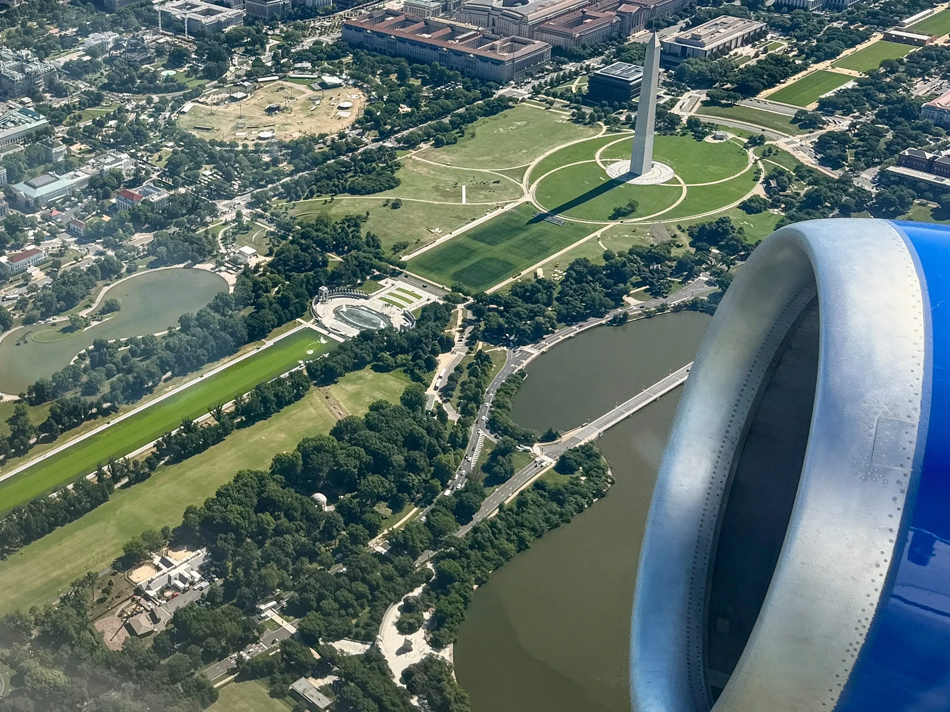 WASHINGTON, DC - JUNE 16: Water in the Lincoln Memorial Reflecting Pool (lower right) is shown from a departing flight from Ronald Reagan National Airport as algae continues to bloom following the completion of recent renovations on June 16, 2026 in Washington, DC.
