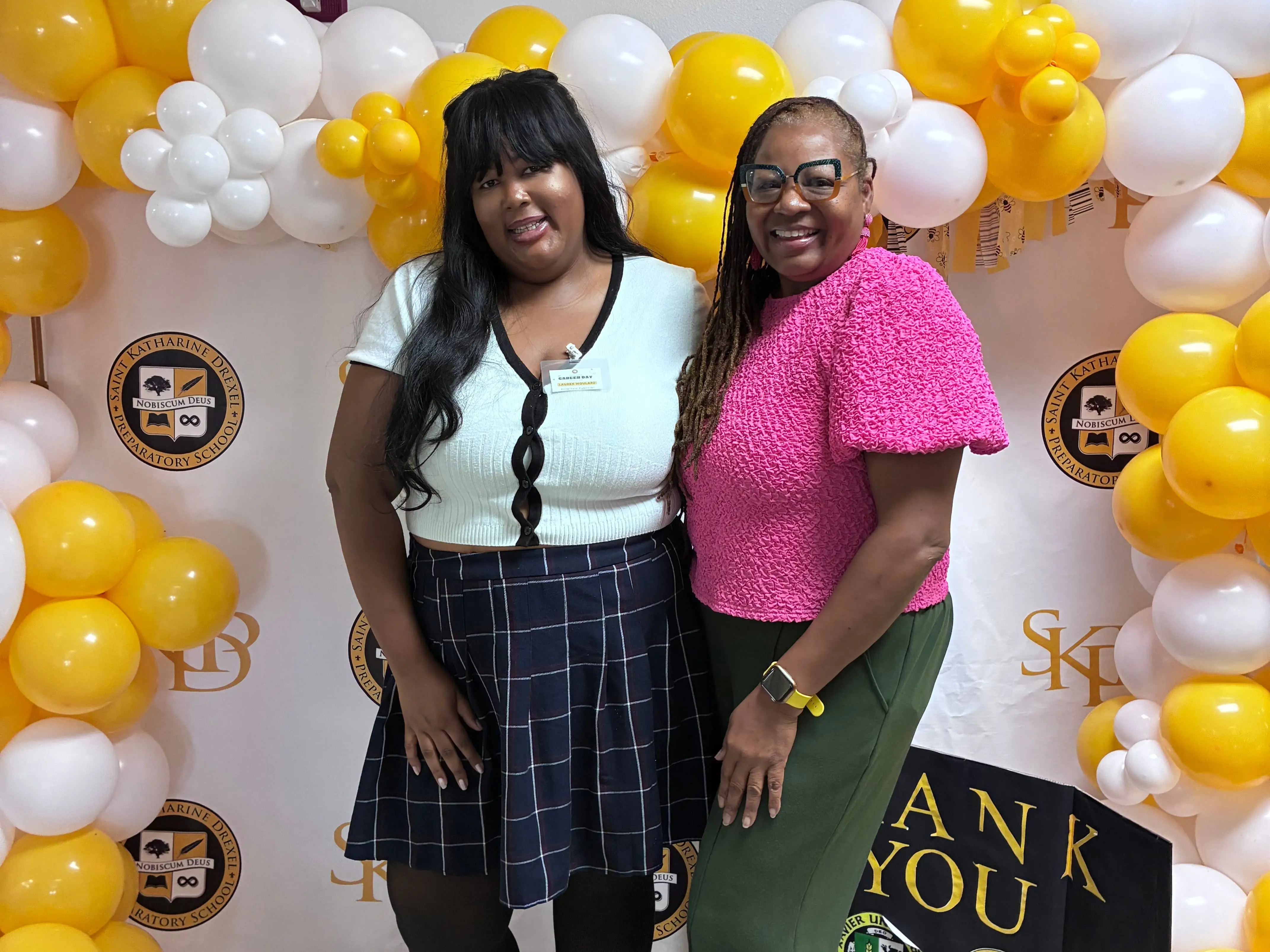 The writer and her mom posing at the writer's high school career day.