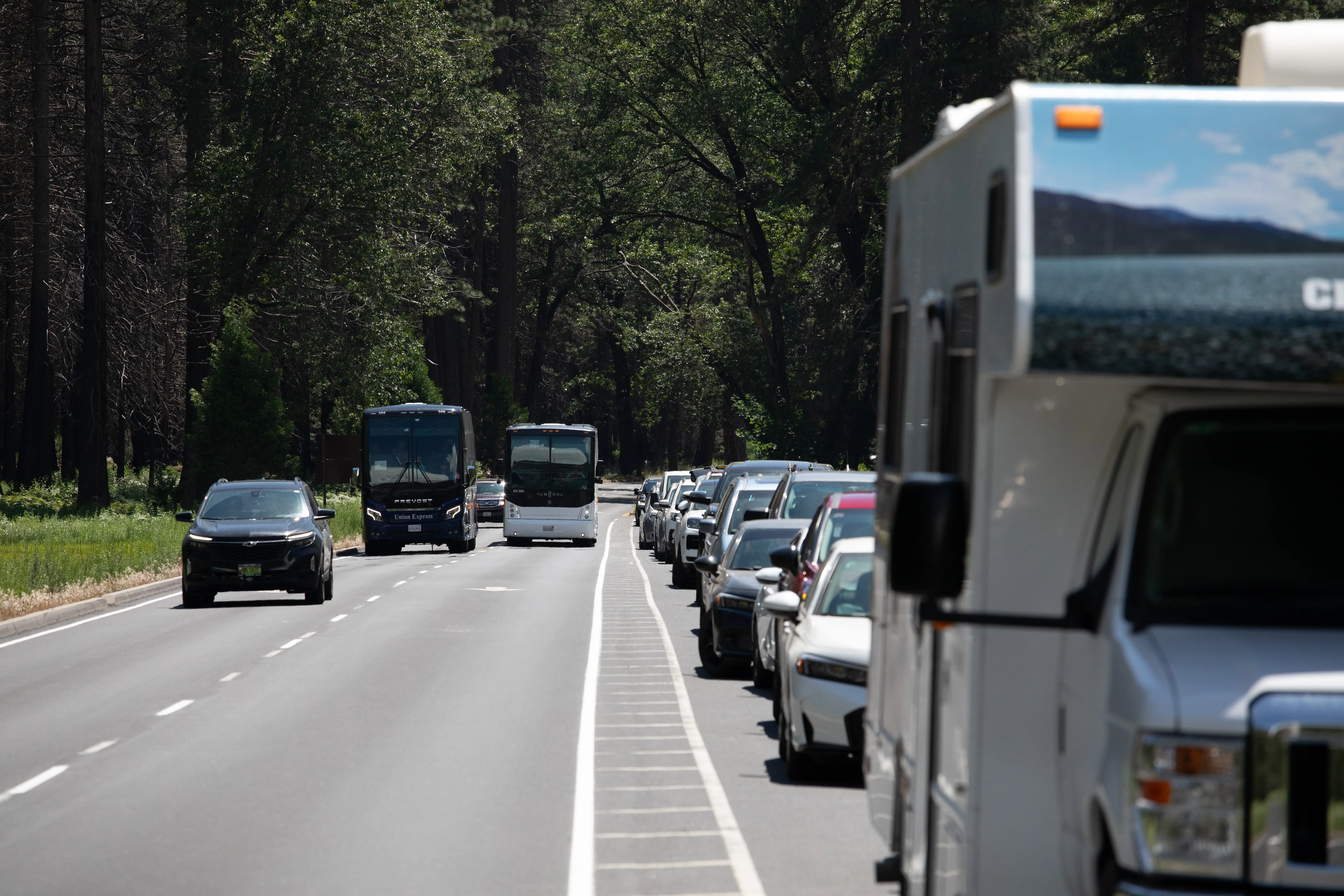 Cars line the road during peak visitor hours creating traffic congestion in Yosemite Valley National Park,
