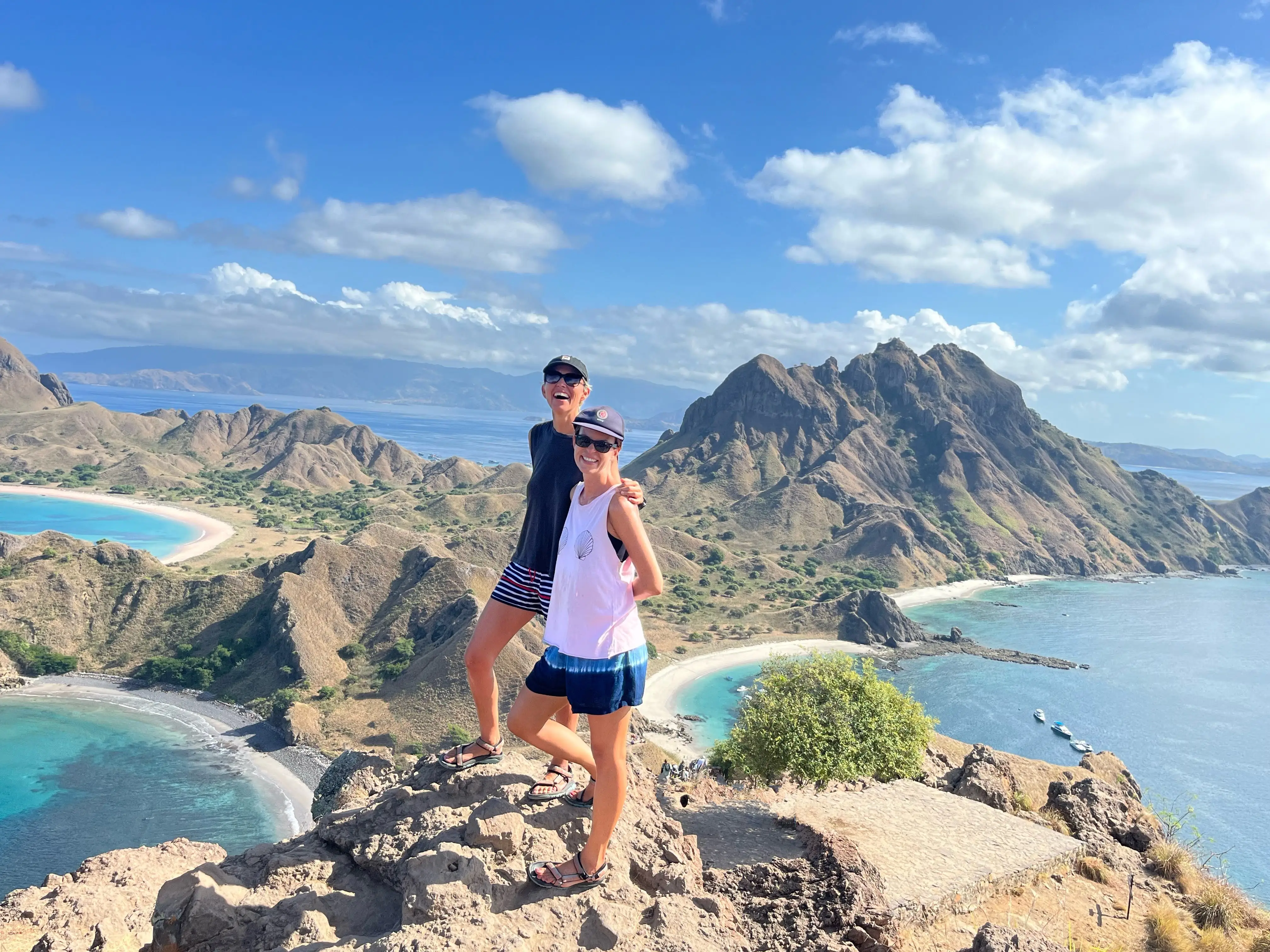 A couple standing by the sea in Southeast Asia.