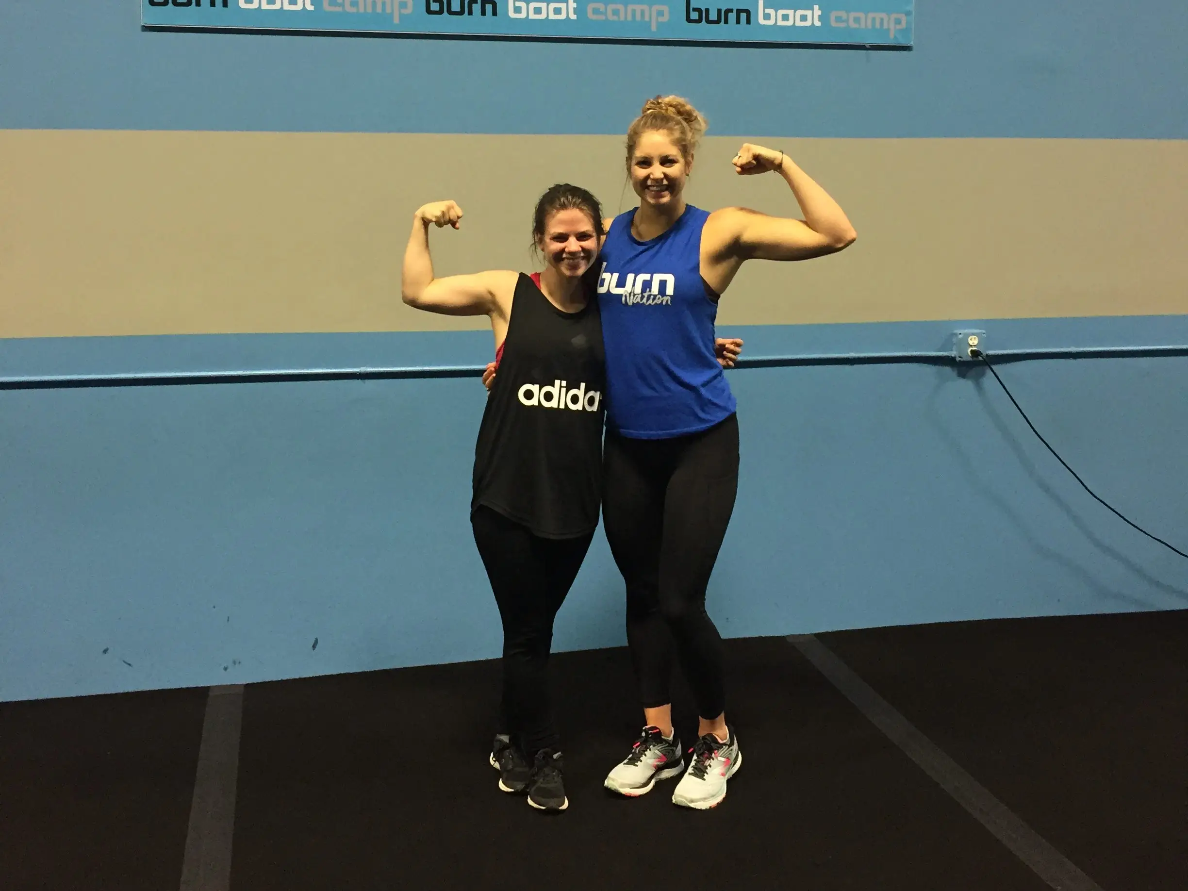 The author poses with her personal trainer