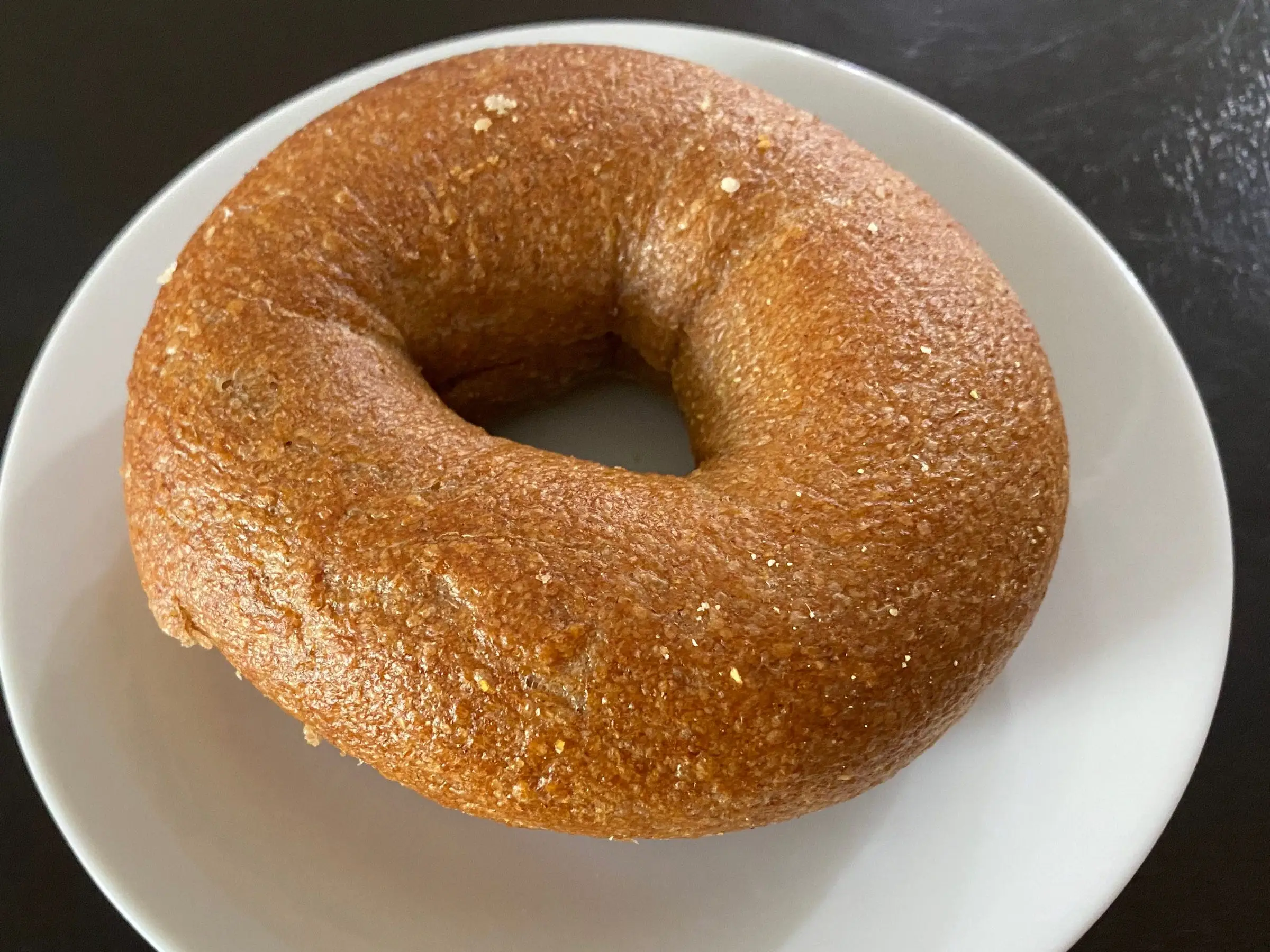 honey-wheat bagel on plate