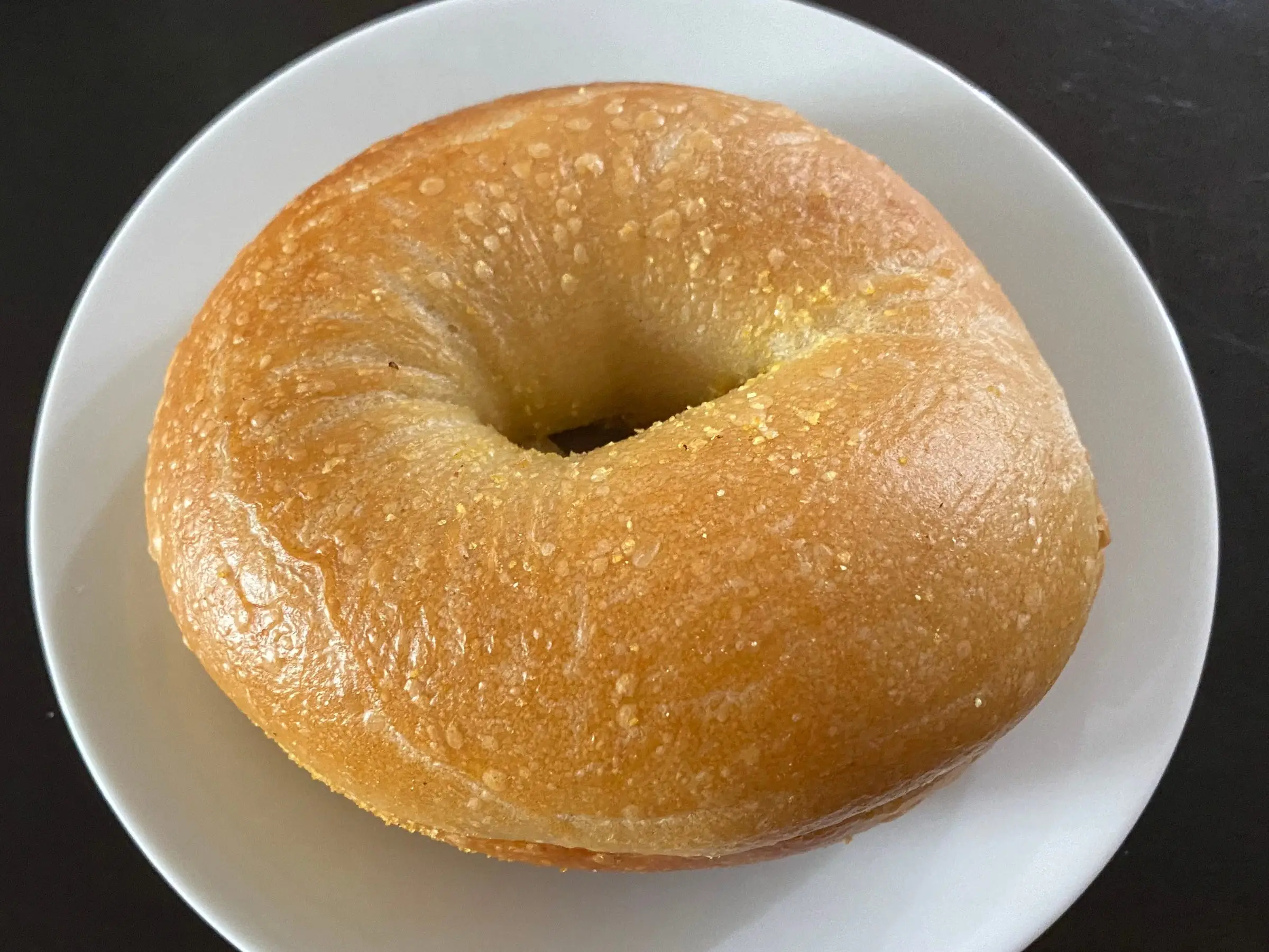 plain bagel from Einstein bros on plate