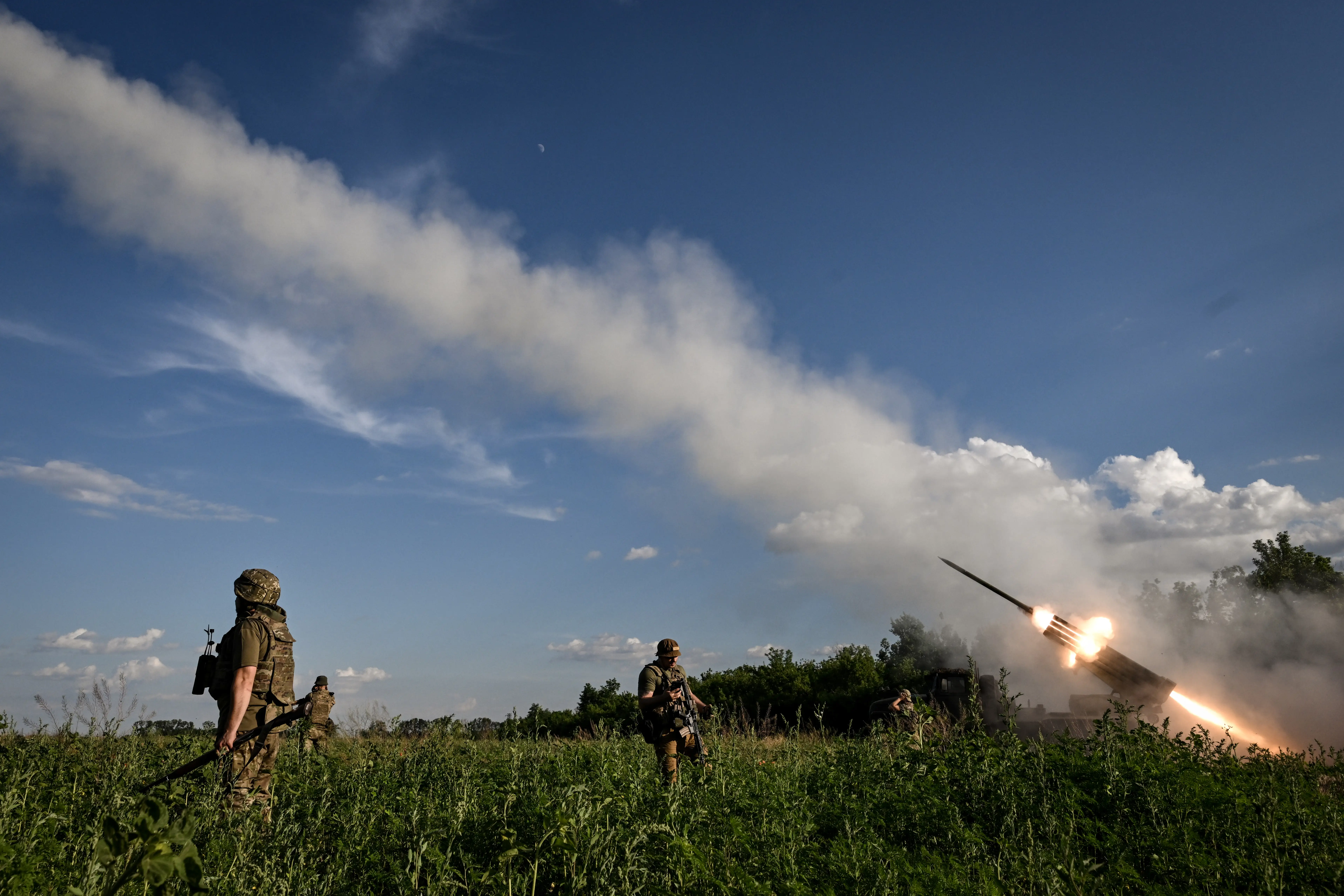 Soldiers from the 148th Separate Artillery Zhytomyr Brigade of the Ukrainian Airborne Forces fire missiles from a BM-21 Grad MLR in the Oleksandrivka sector, Dnipropetrovsk region, Ukraine, on June 22, 2026.