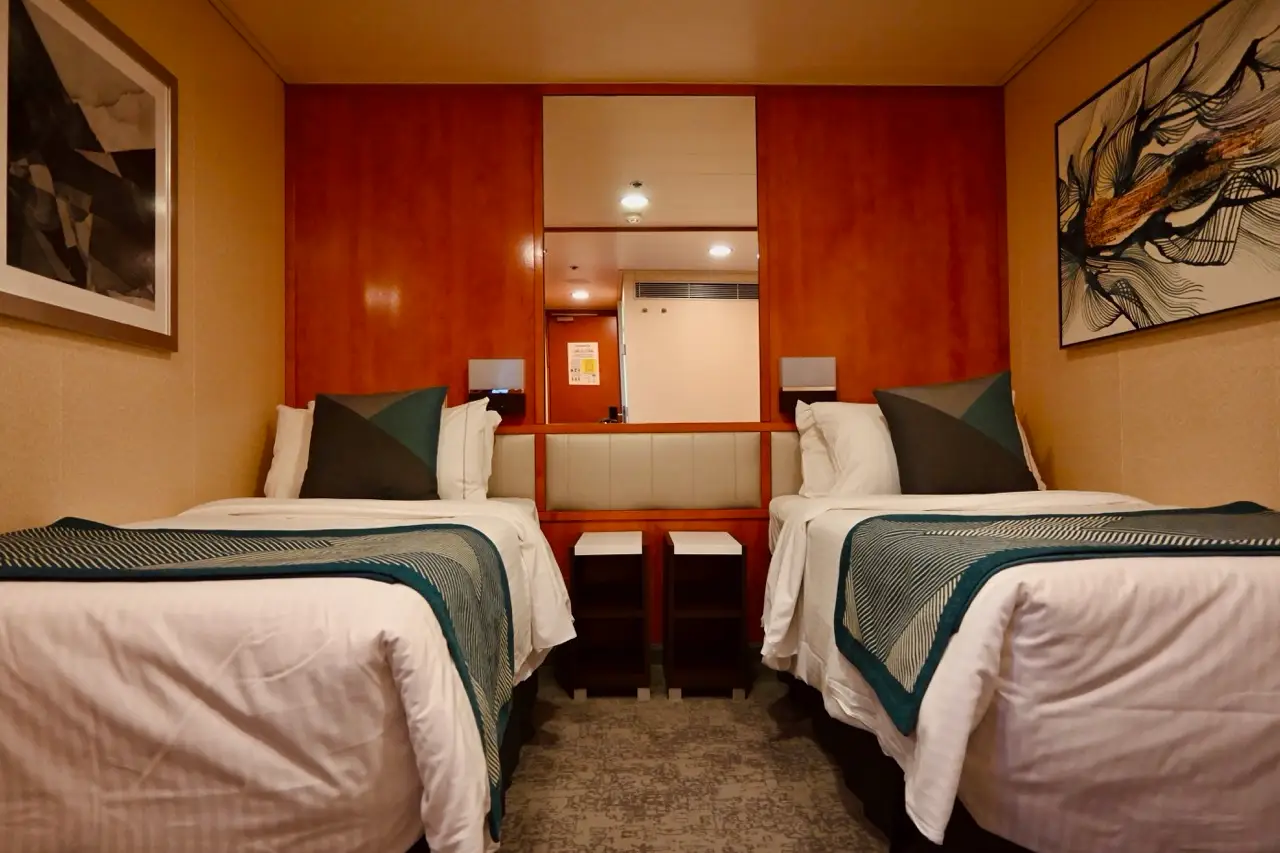 Interior cabin on Norwegian Sun with two beds