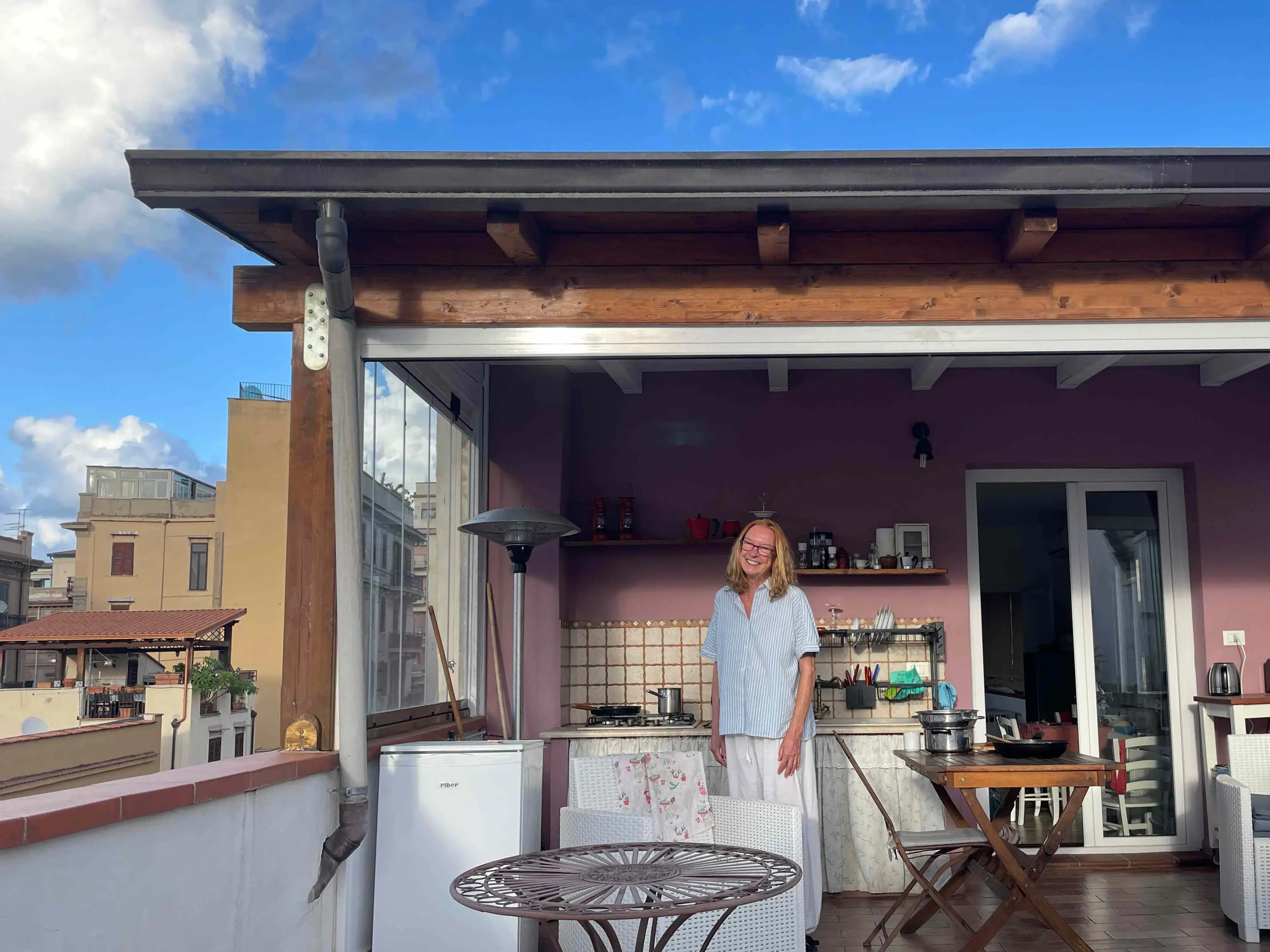 A woman posing in an Airbnb in Palermo, the capital of Sicily in Italy.